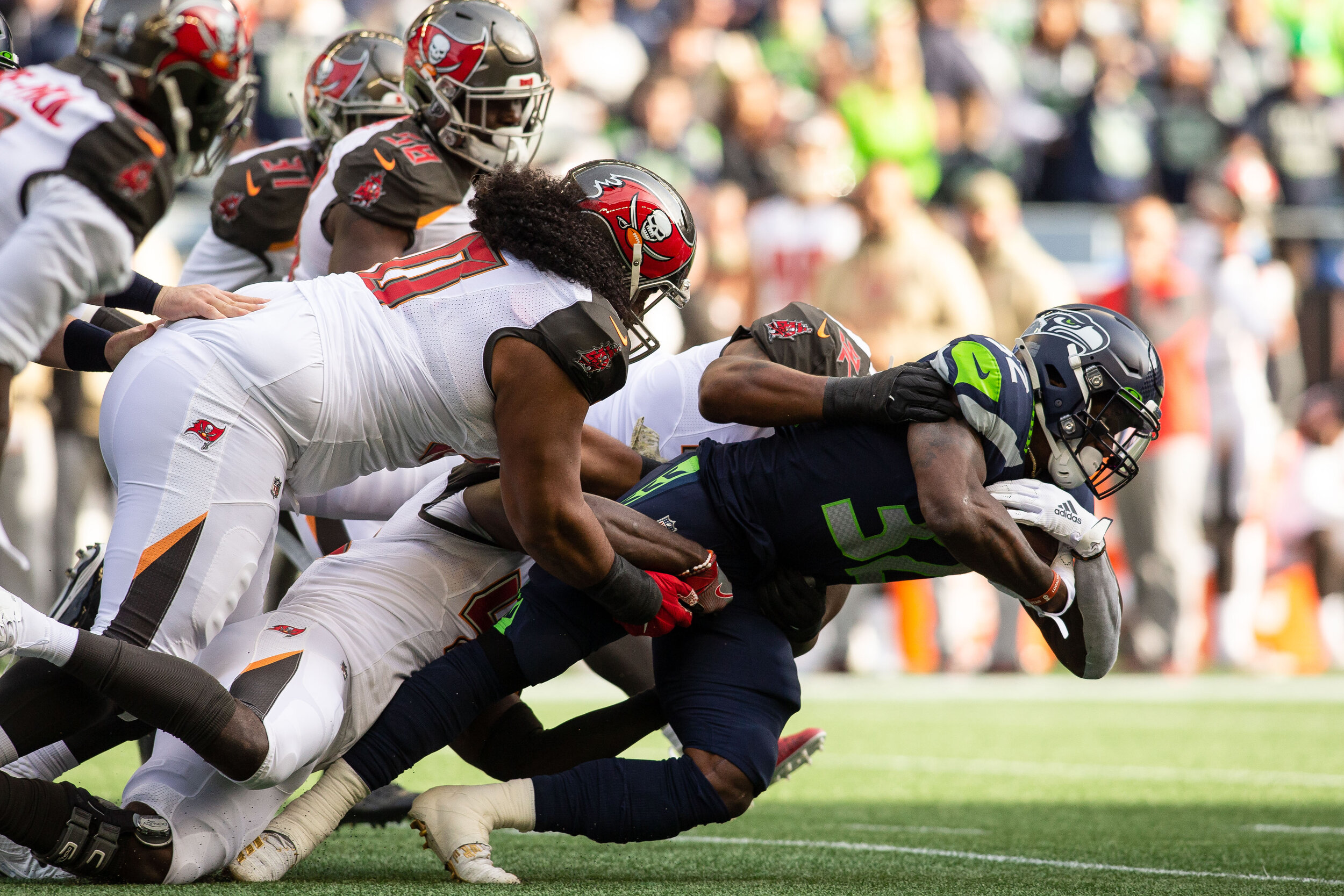  Seattle Seahawks running back Chris Carson (32) drives for extra yards during the first quarter of an NFL football game against the Tampa Bay Buccaneers, Sunday, Nov. 3, 2019, in Seattle. Seattle defeated Tampa Bay 40-34 in overtime. (Matt Ferris/Im