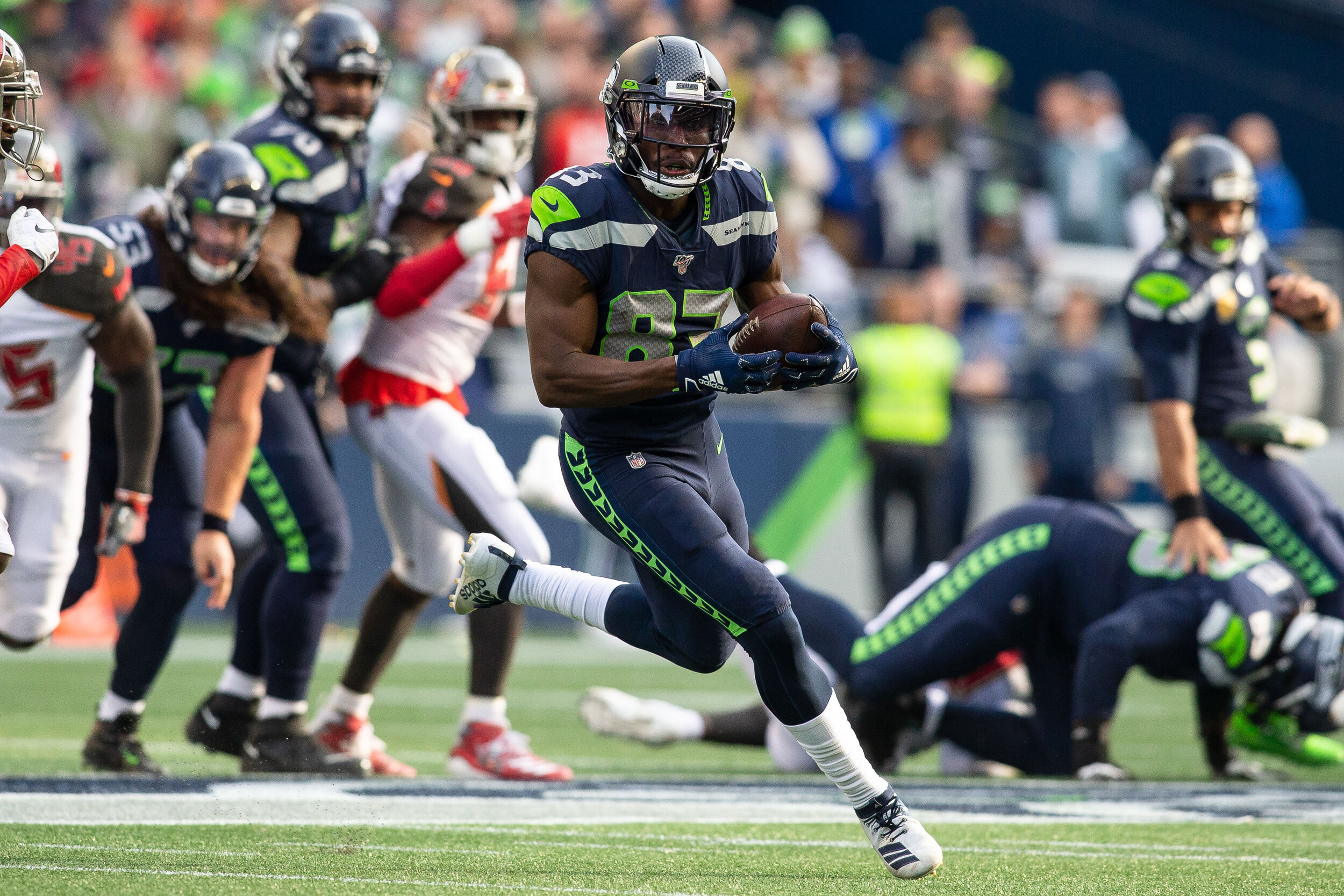  Seattle Seahawks wide receiver David Moore (83) runs with the ball after a catch in the second quarter of an NFL football game against the Tampa Bay Buccaneers, Sunday, Nov. 3, 2019, in Seattle. Seattle defeated Tampa Bay 40-34 in overtime. (Matt Fe