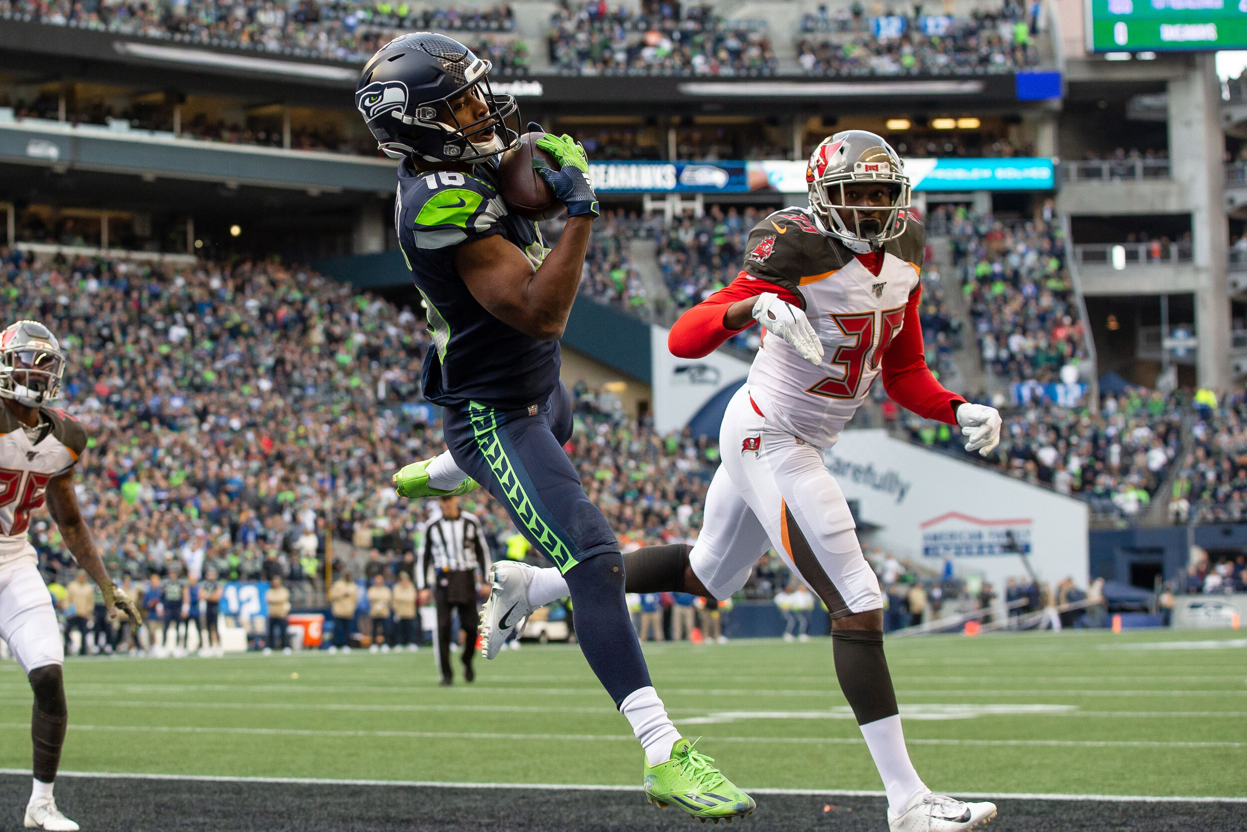  Seattle Seahawks wide receiver Tyler Lockett (16) catch a touchdown pass in the end zone over Tampa Bay Buccaneers defensive back Jamel Dean (35) during the third quarter of an NFL football game, Sunday, Nov. 3, 2019, in Seattle. Seattle defeated Ta