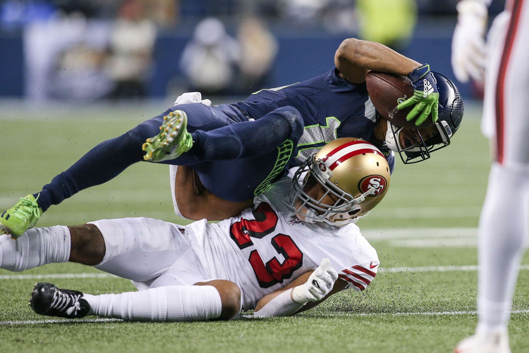  Seattle Seahawks wide receiver Tyler Lockett (16) tackled after a catch and run by San Francisco 49ers cornerback Ahkello Witherspoon (23) during the second quarter of an NFL football game, Sunday, December 29, 2019, in Seattle. The 49ers defeat the