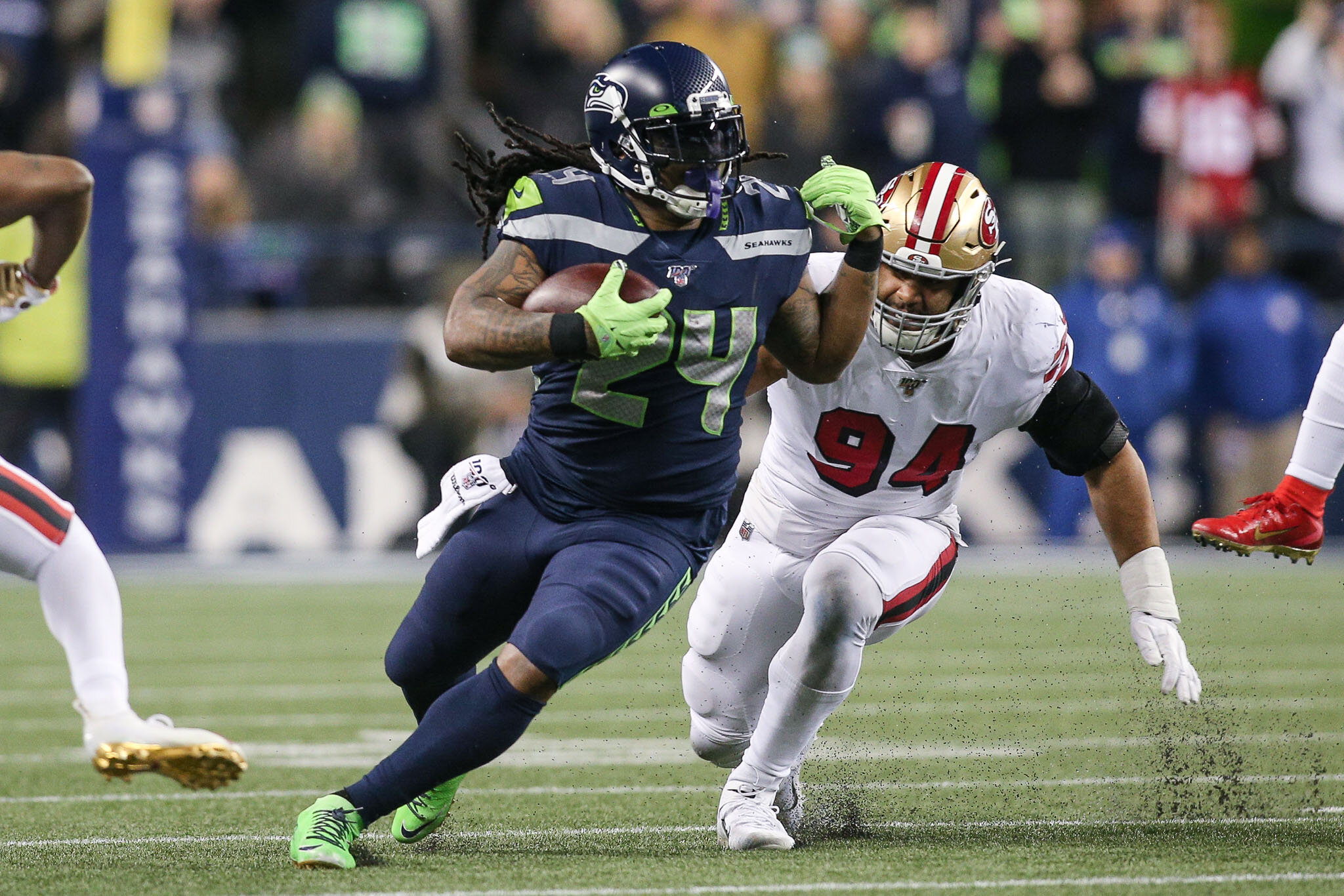  Seattle Seahawks running back Marshawn Lynch (24) runs past San Francisco 49ers defensive end Solomon Thomas (94) during the third quarter of an NFL football game, Sunday, December 29, 2019, in Seattle. The 49ers defeat the Seahawks 26-21. (Matt Fer