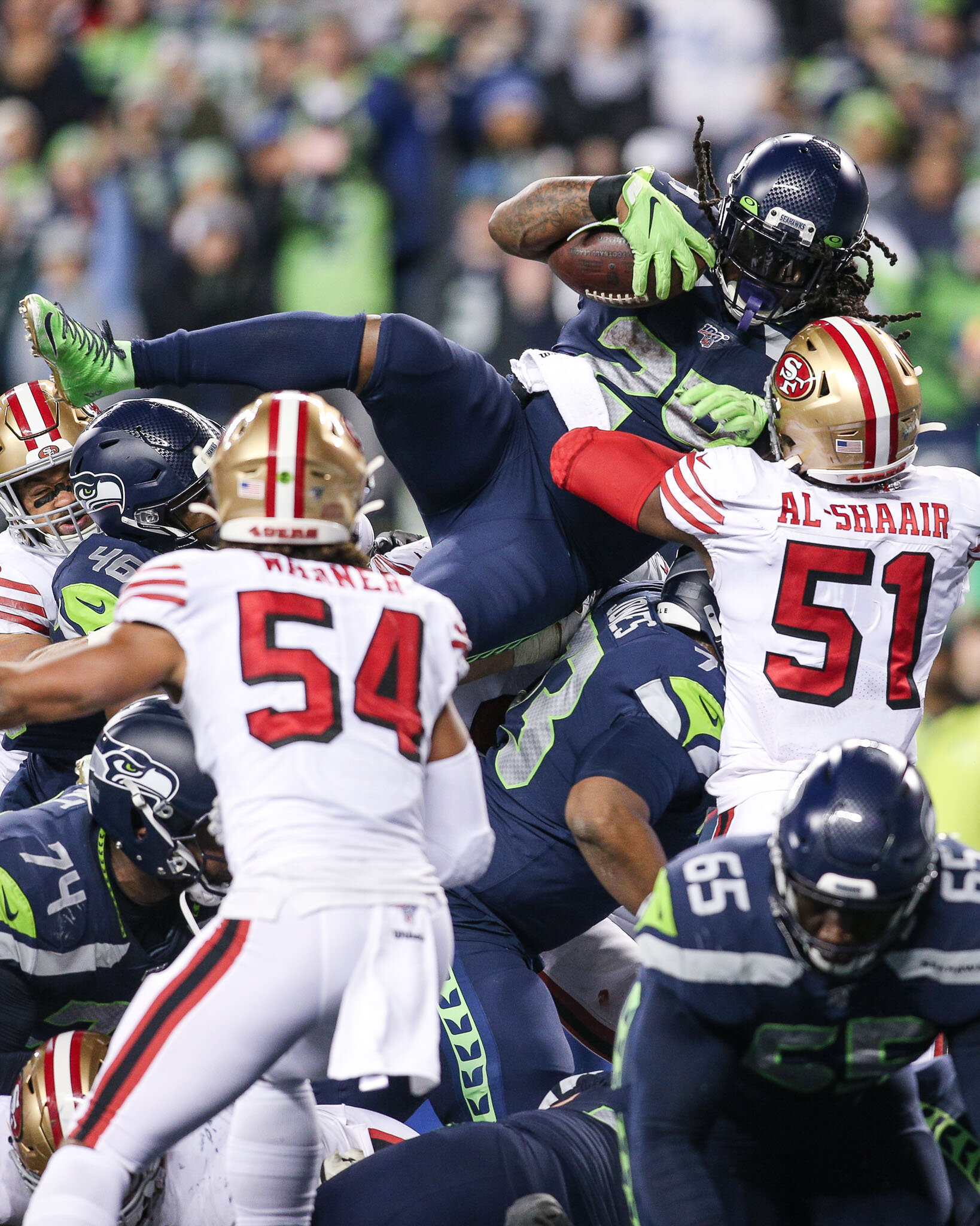  Seattle Seahawks running back Marshawn Lynch (24) dives over the pile at the line of scrimmage to score a touchdown during the fourth quarter of an NFL football game against the San Francisco 49ers, Sunday, December 29, 2019, in Seattle. The 49ers d