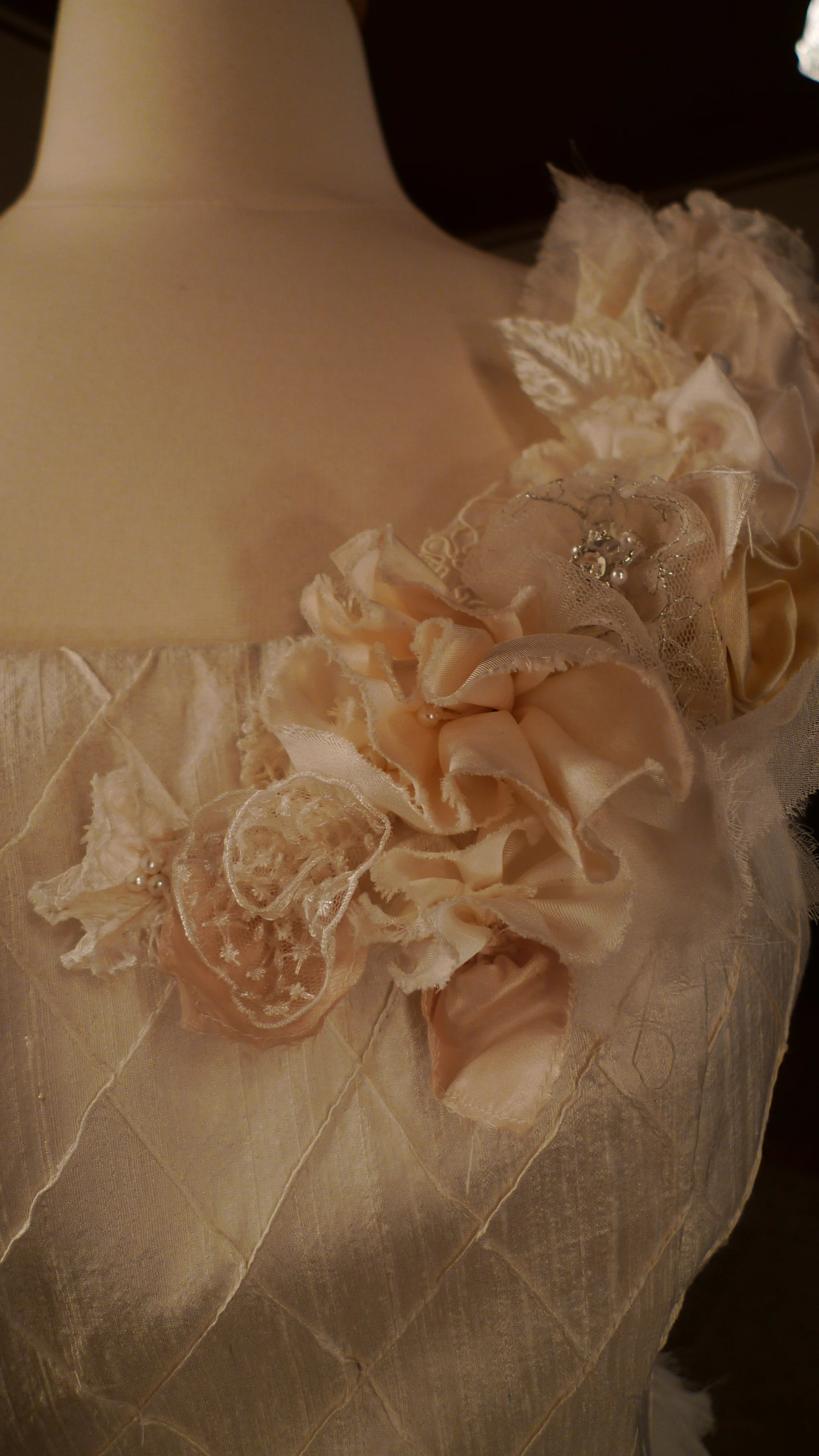 . . . one of a kind wedding dress . . . detail of hand made silk flowers in various vintage fabrics. 