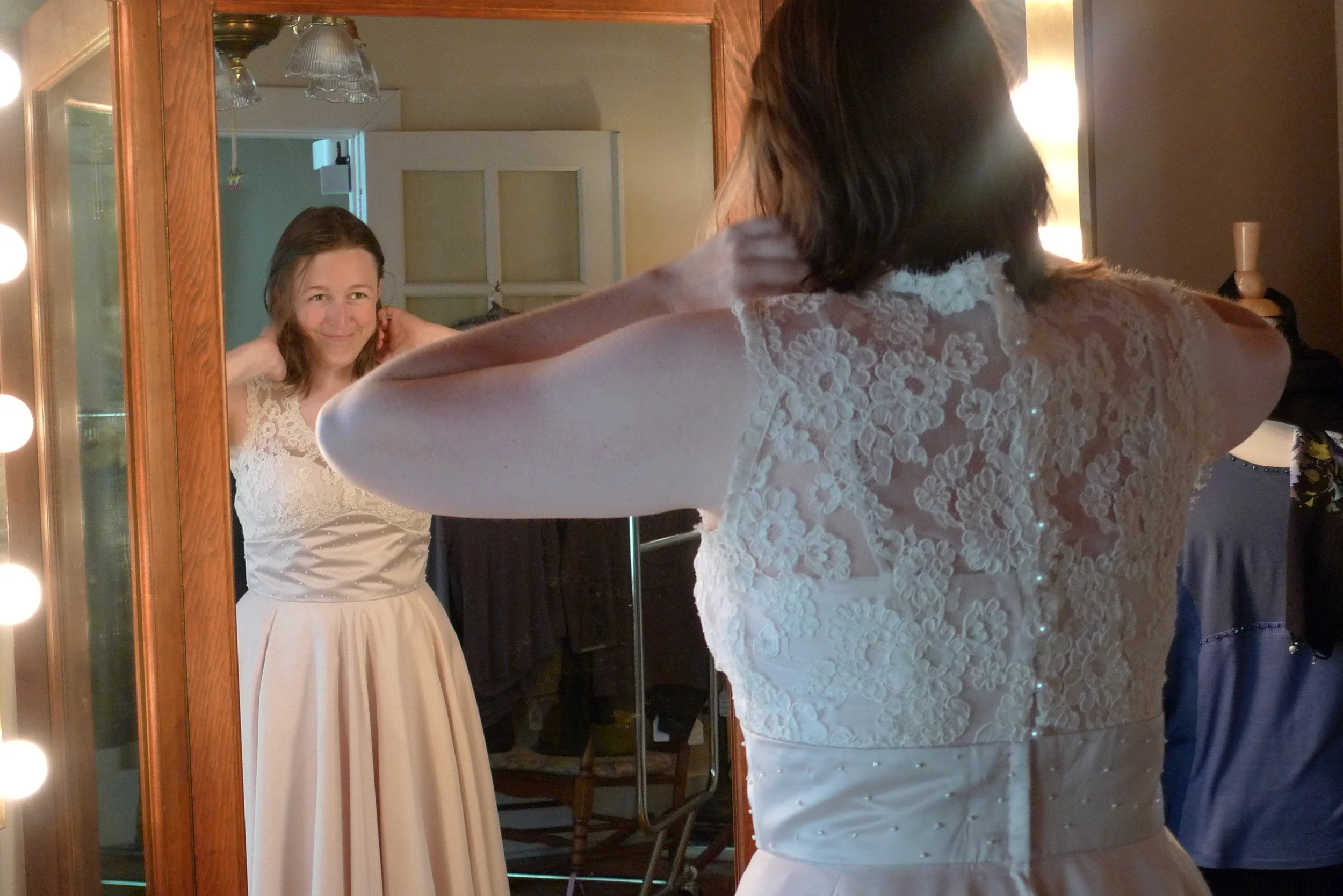  . . . with French lace bodice and pearl-beaded waistline . . . 