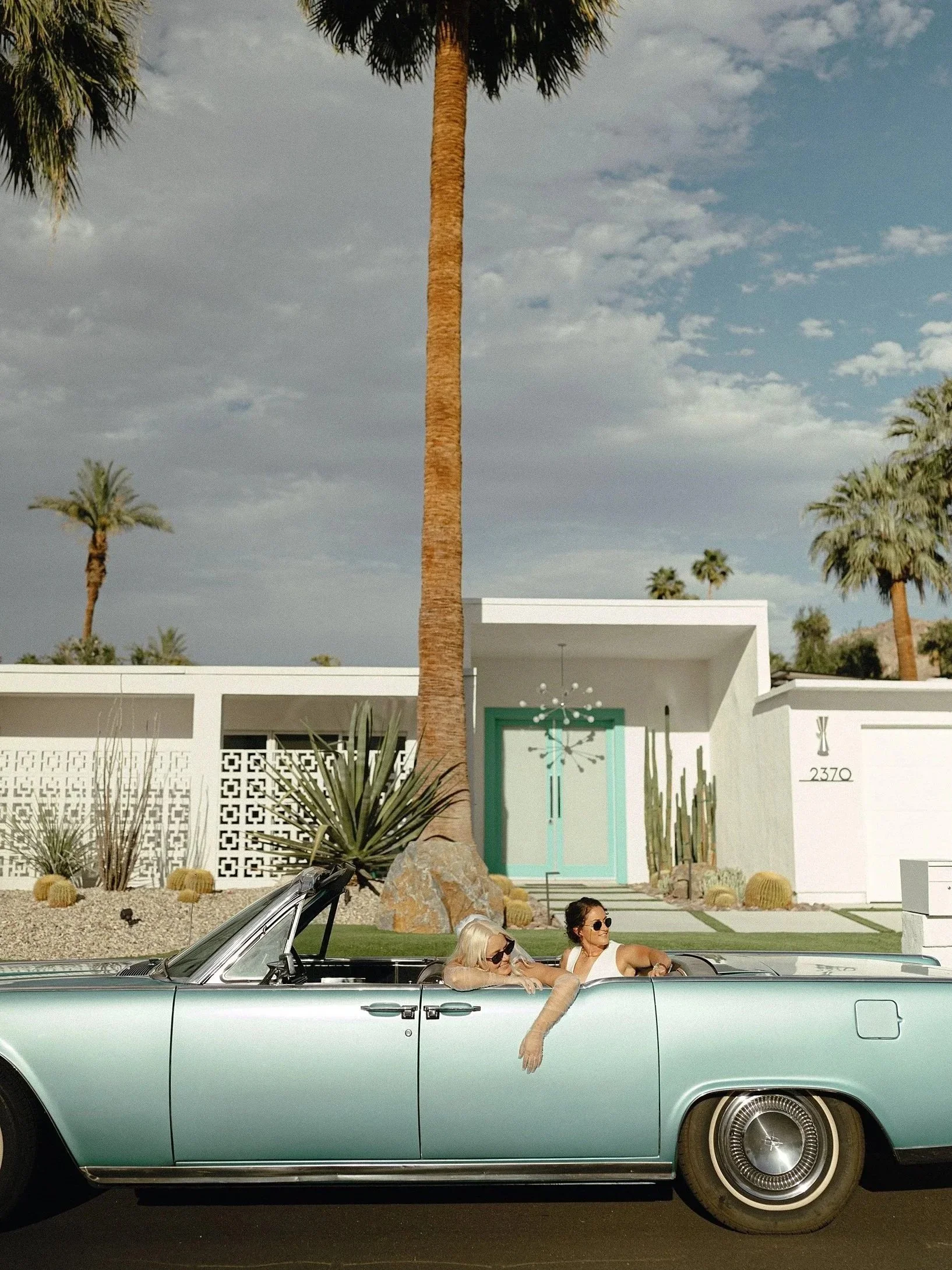 wlw couple elopes in Palm Springs with vintage car