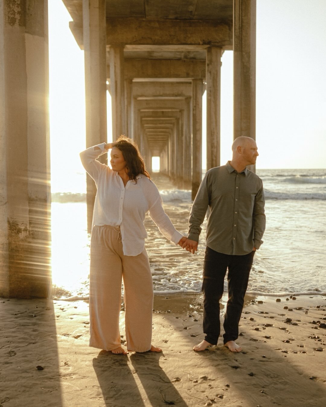 Golden hour really did her thing here ✨

A dreamy engagement sesh at #ScrippsPier 
#sandiegoweddingphotographer #sandiegoengagementphotographer #beachengagementphotos #scrippspier