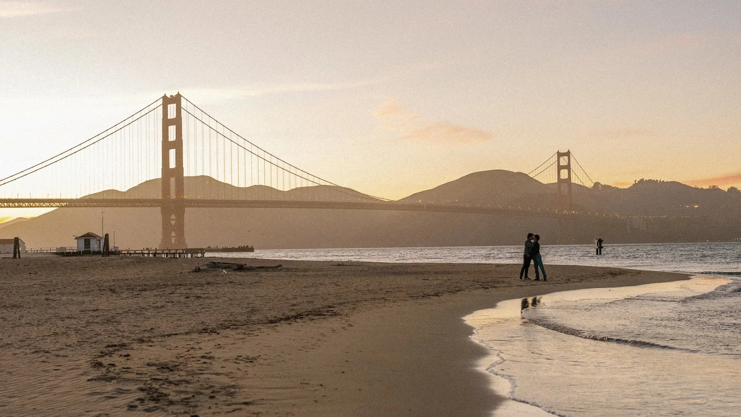 Cinematic engagement photos with the Golden Gate Bridge for a gay couple