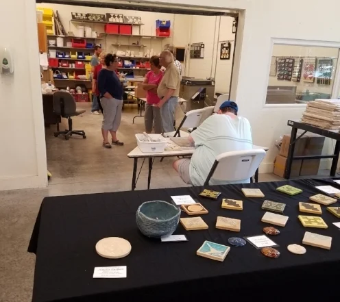 A view of the ceramics studio and a selection of tile products on display.
