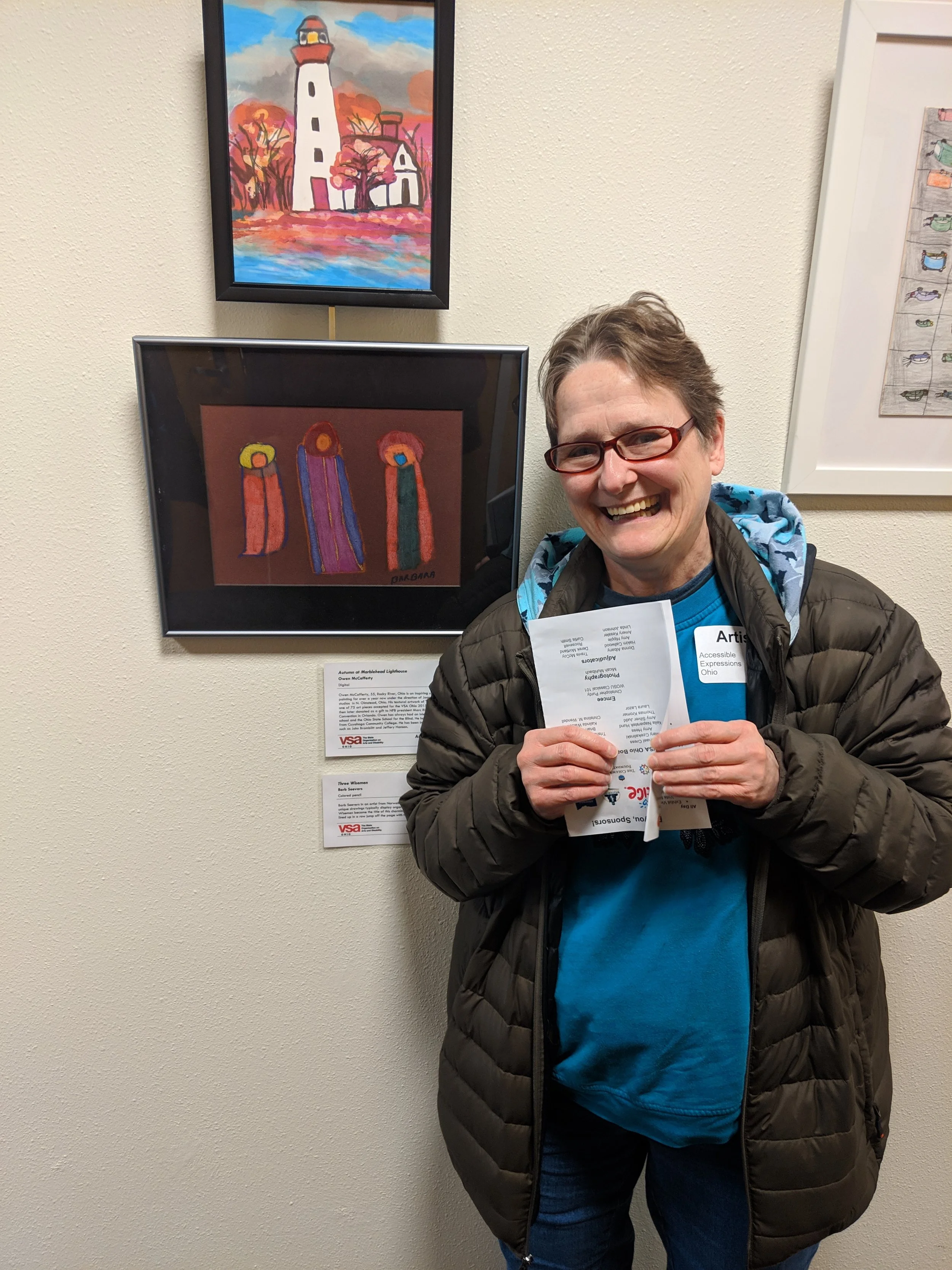 AOS artist Barb Seevers next to her colored pencil drawing “Three Wisemen”