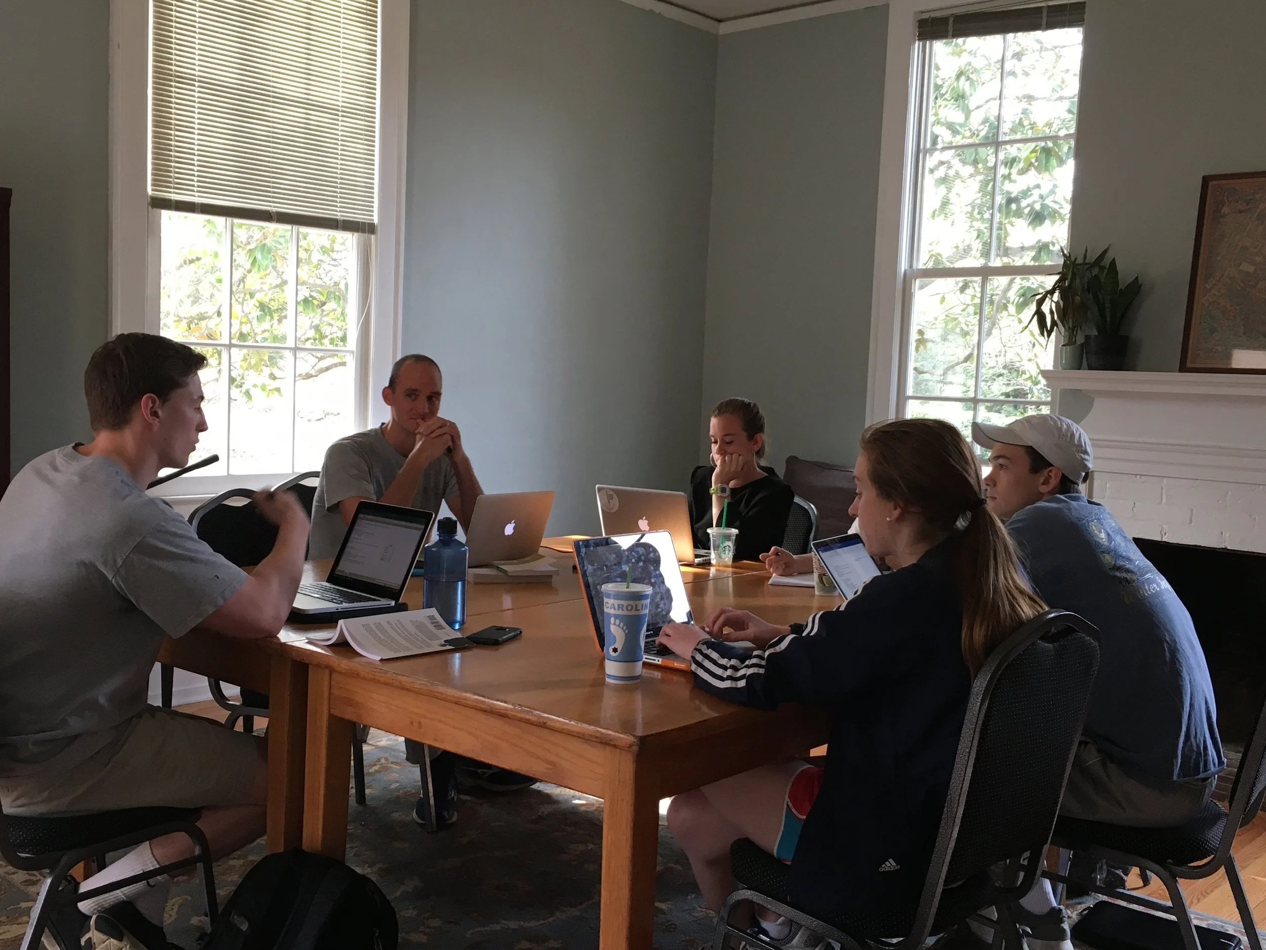 Executive Director Madison Perry, in partnership with a senior business school student, leading a discussion group on personal finance and stewardship.