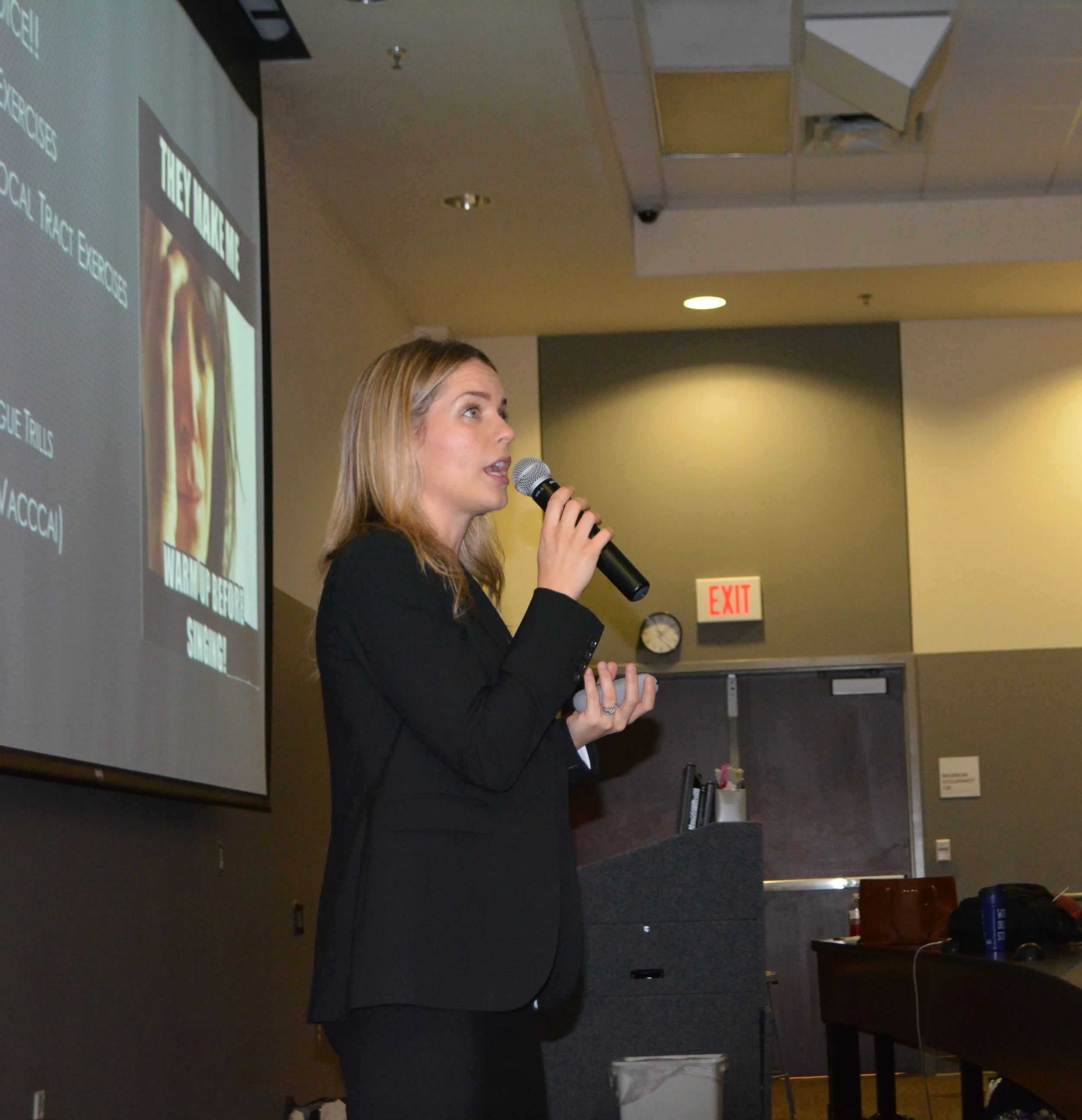 Kristie lectures choir and theatre students about the importance of vocal health and hygiene.