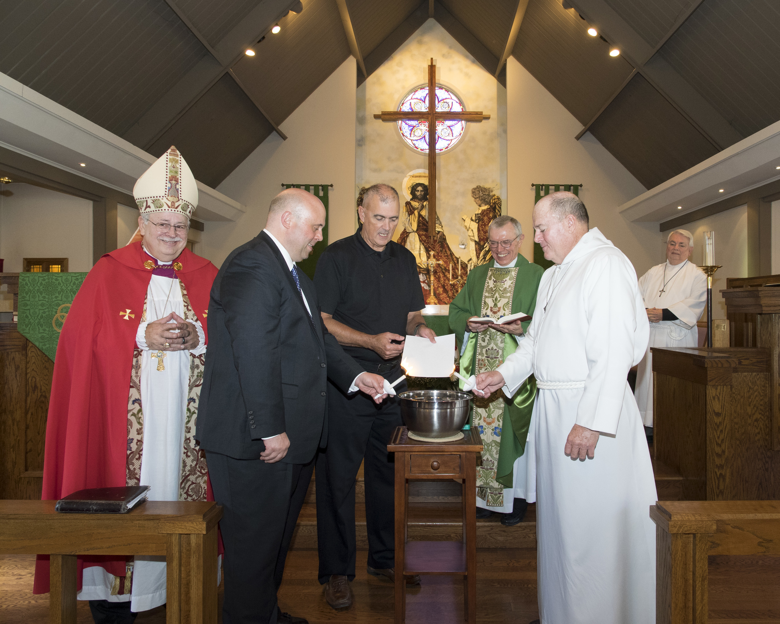  The mortgage burning ceremony with Bishop Grote, Bill Petry, John Gregory, Father Ron Martin, and Woody Freeman This ceremony was made possible by a generous donation by Bill Petry. Bill was here to honor his mother, Margaret Petry, and to celebrate with the church on the Sunday nearest her birthday.