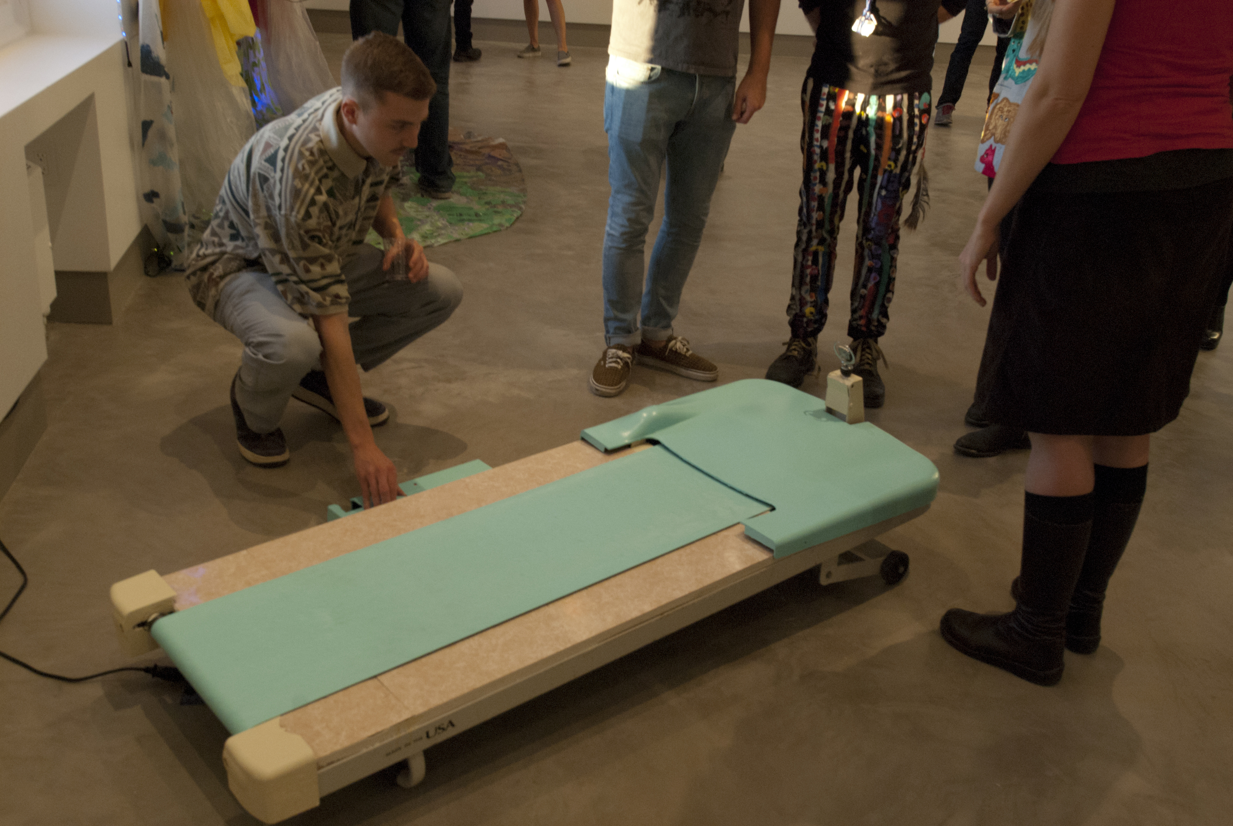 Matt Goldberg showcases his sculpture Cadillac Treadmill in movement to fellow artists.
