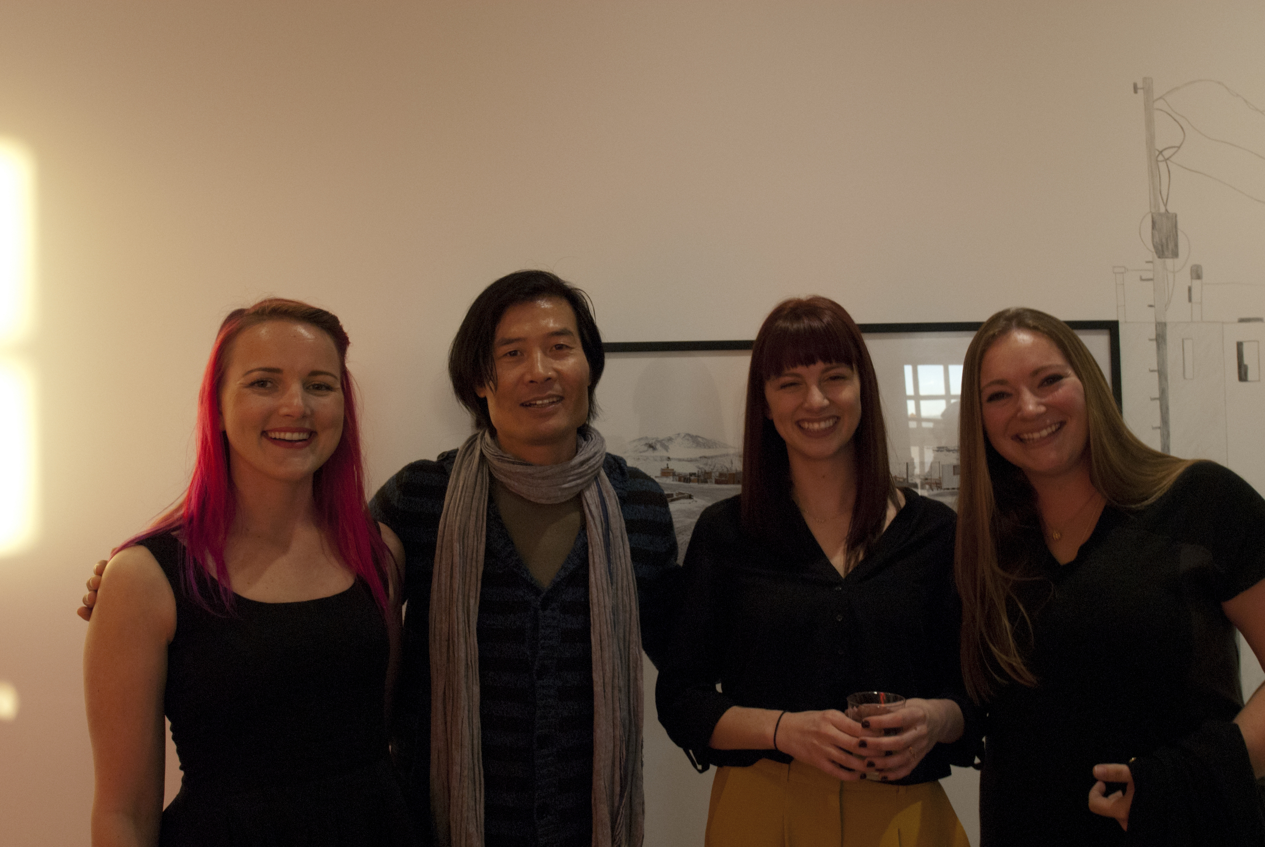 The Embark Gallery team, Carolyn Nickell, Angelica Jardini and Tania Houtzager, share a laugh with juror for the exhibition and esteemed artist, Michael Zheng.