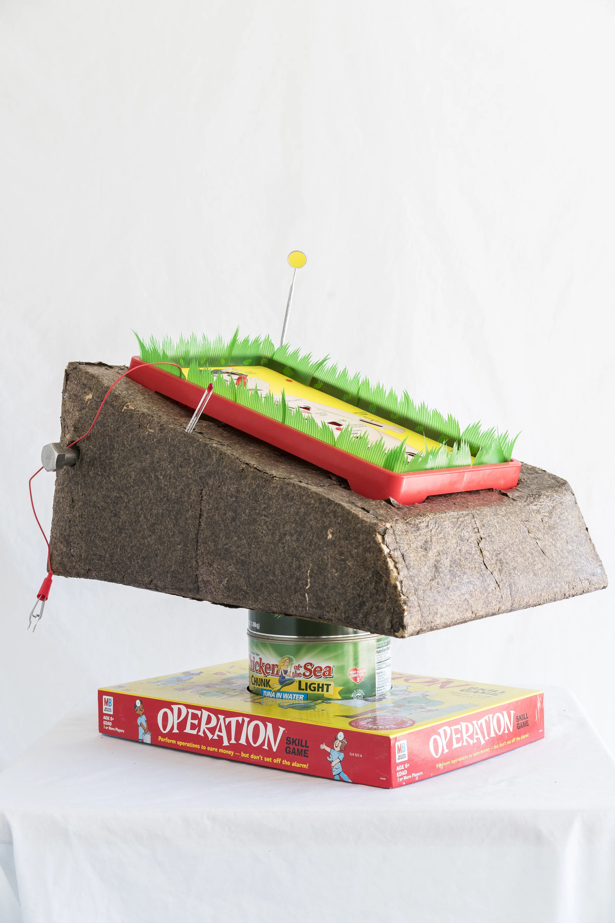 Matt Goldberg. Mercury Surgery , 2018. Ceramic, faux seaweed, thermometer, dentist mirror, Operation board game, tuna cans, bolts.