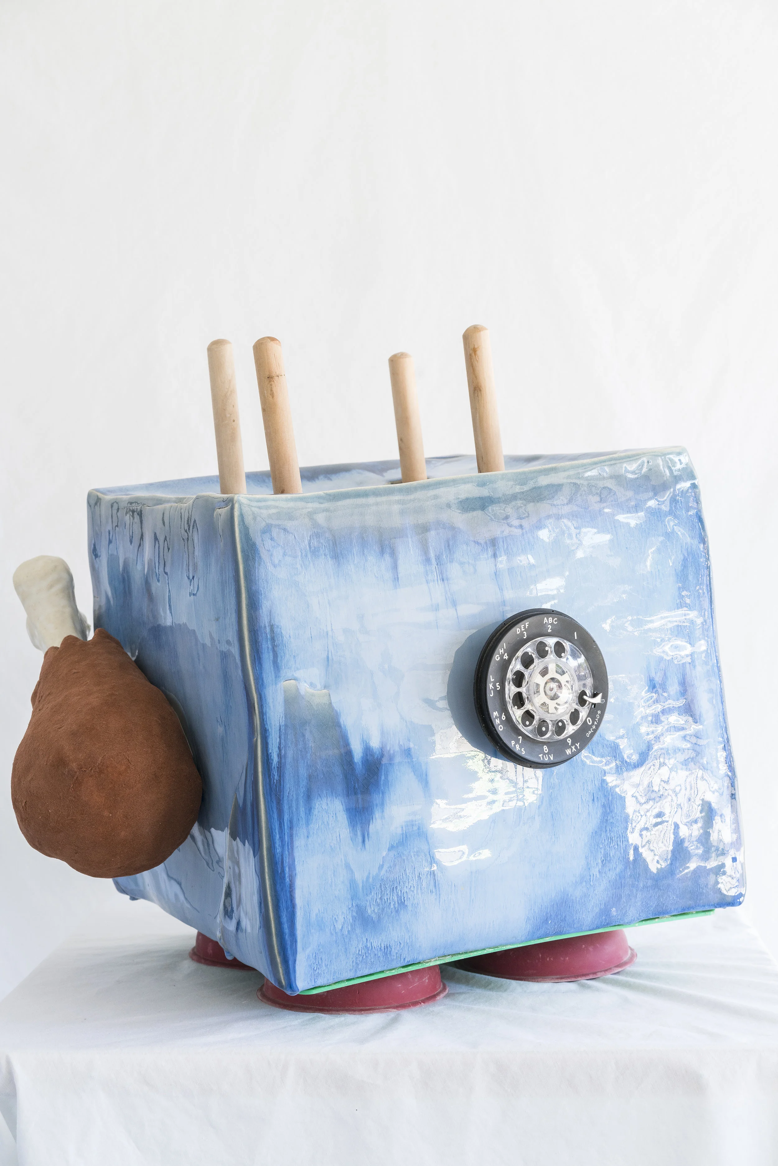Matt Goldberg. Cold Turkey , 2018. Ceramic, plungers, rotary phone dial, flocking.