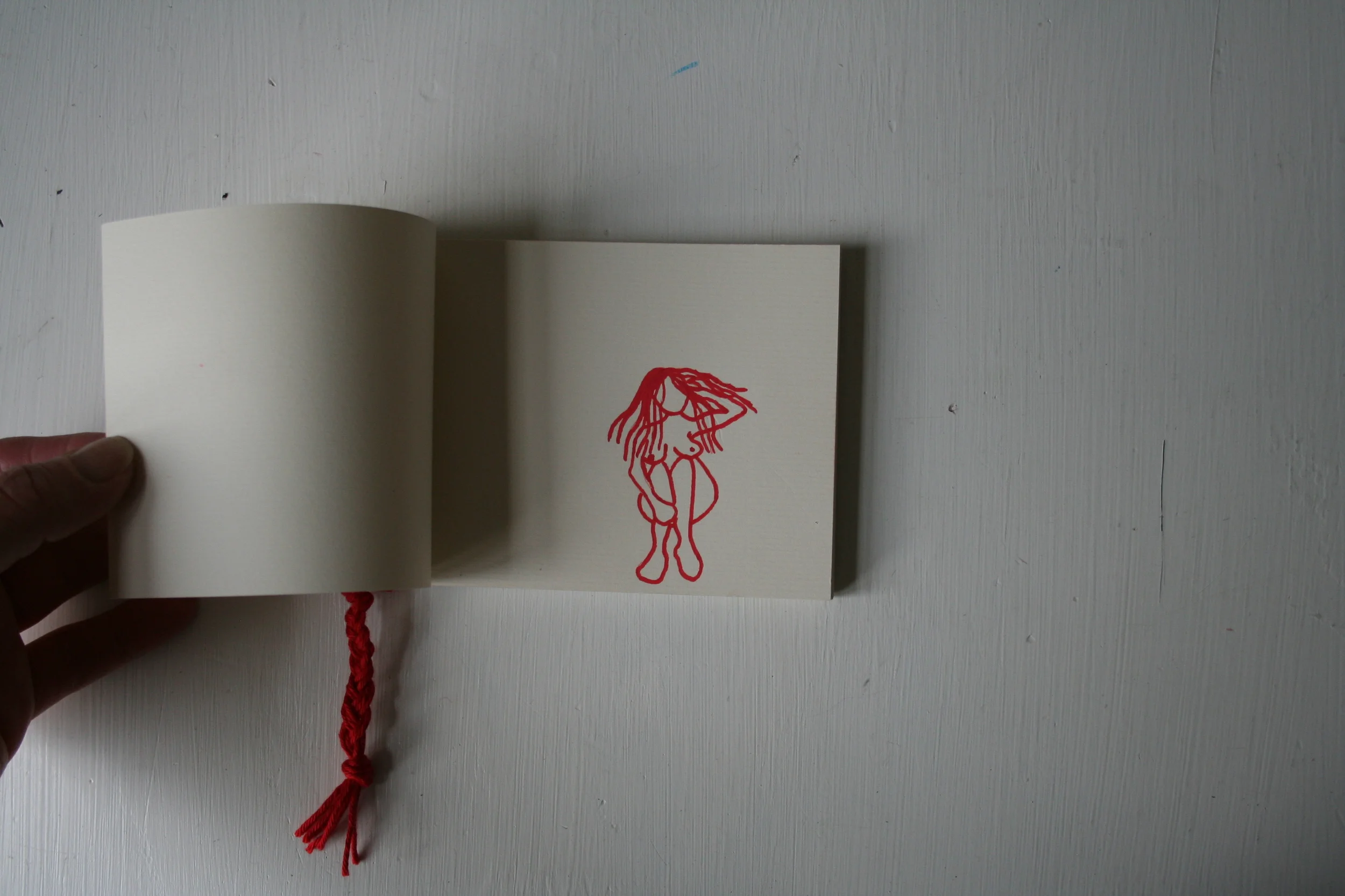 Hair, (flip book, drawing on paper, hand bound with wool, 2010).