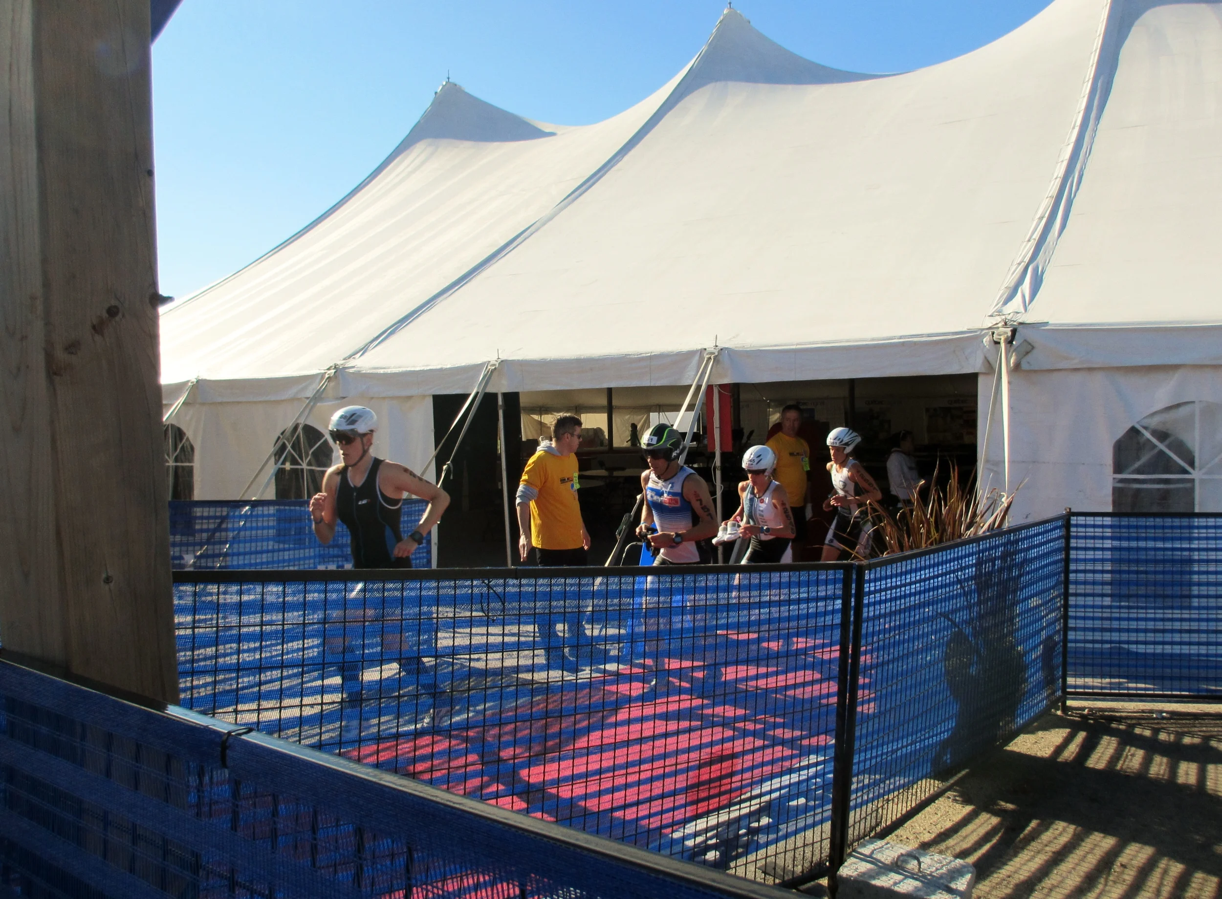 Em sprinting out of T1 after a PR swim. 