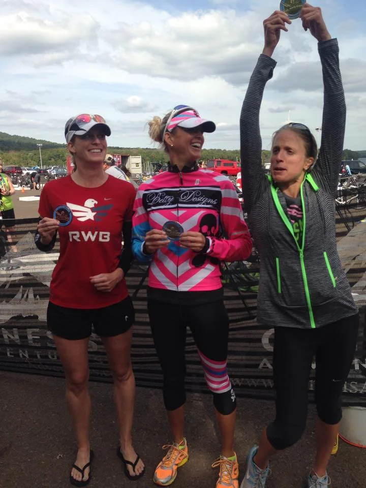 Top Three Female Finishers at the Olympic Plus Distance. No idea what I am doing, and clearly Katherine and Ginny don't either. Photo credit goes to Katherine's sister Jacky. 