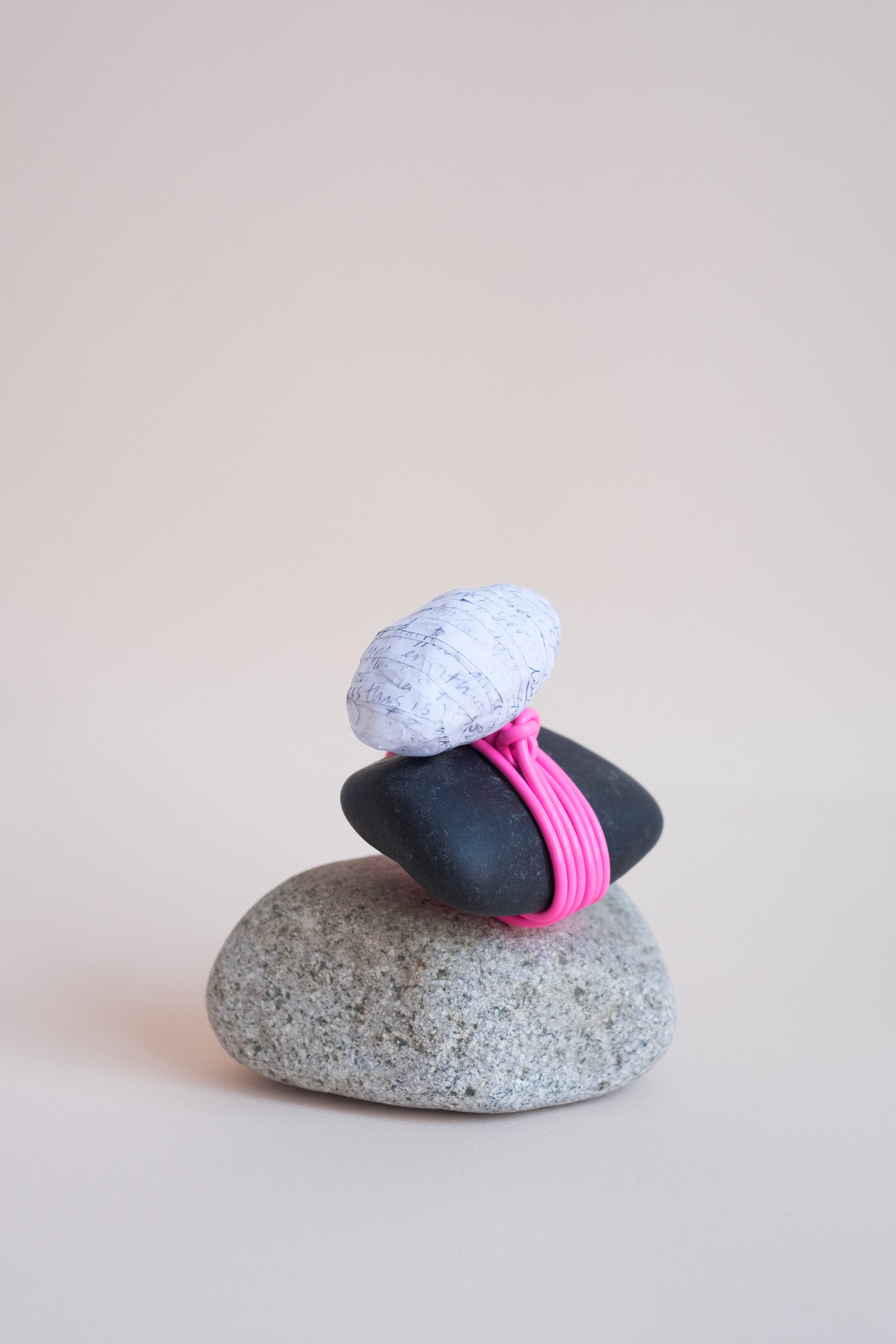 Cairn Journal pages, glue, iPhone charger, rocks 2018