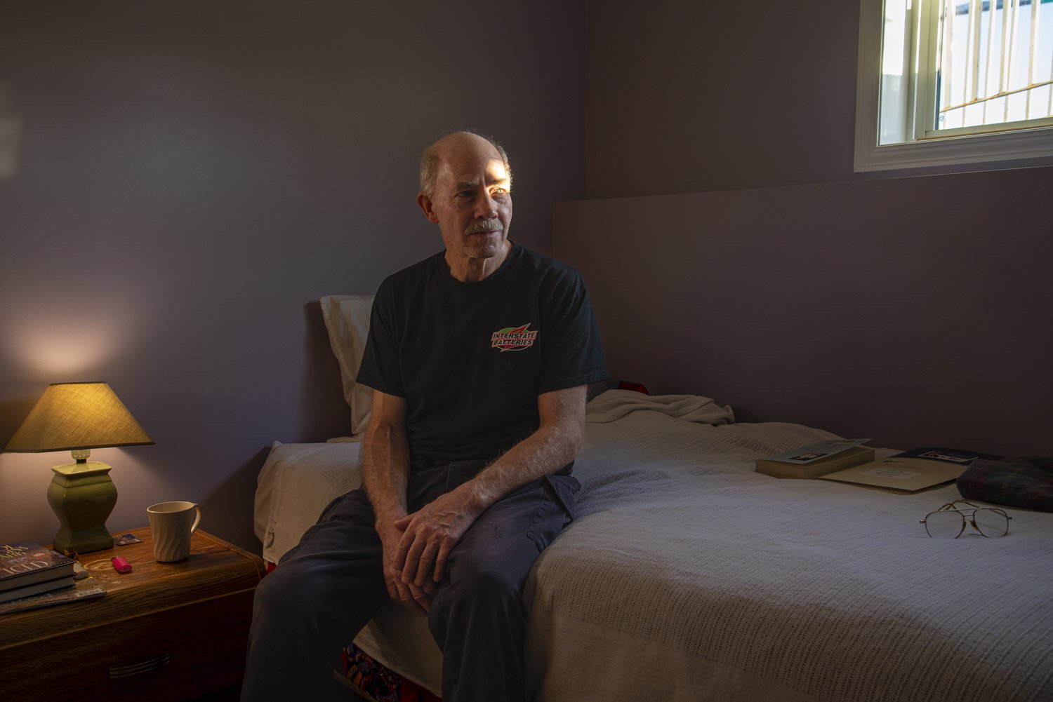 Darryl poses for a portrait in his room at the Elder’s Caring Shelter in Grande Prairie. “After being laid off I struggled financially and it was hard psychologically. The shelter has helped relieve a lot of stress in my life; my stress level i