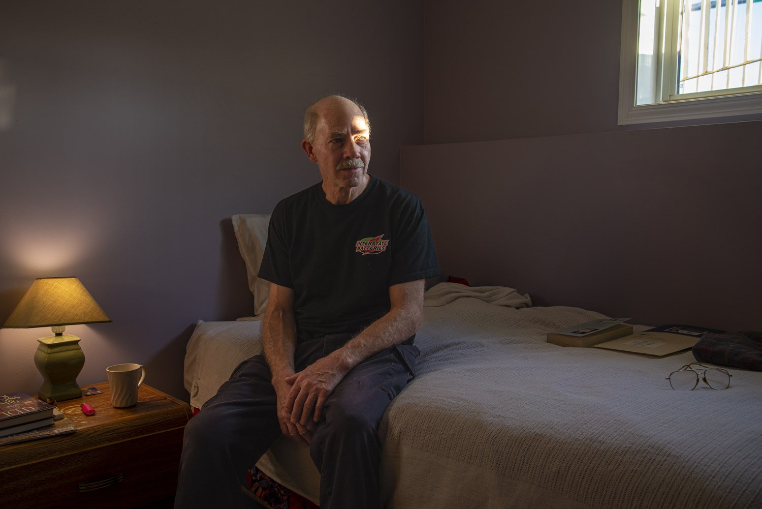  Darryl poses for a portrait in his room at the Elder’s Caring Shelter in Grande Prairie. “After being laid off I struggled financially and it was hard psychologically.&nbsp;The shelter has helped relieve a lot of stress in my life; my stress level i