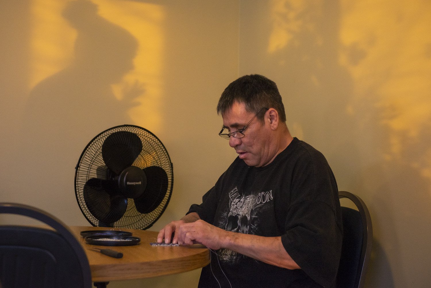 Paul builds a traditional bead necklace that he will sell during the holiday season to raise money in support of the Elder’s Caring Shelter. “The shelter has kept me sober pretty much and helped me have a positive attitude towards life.” Paul Paul