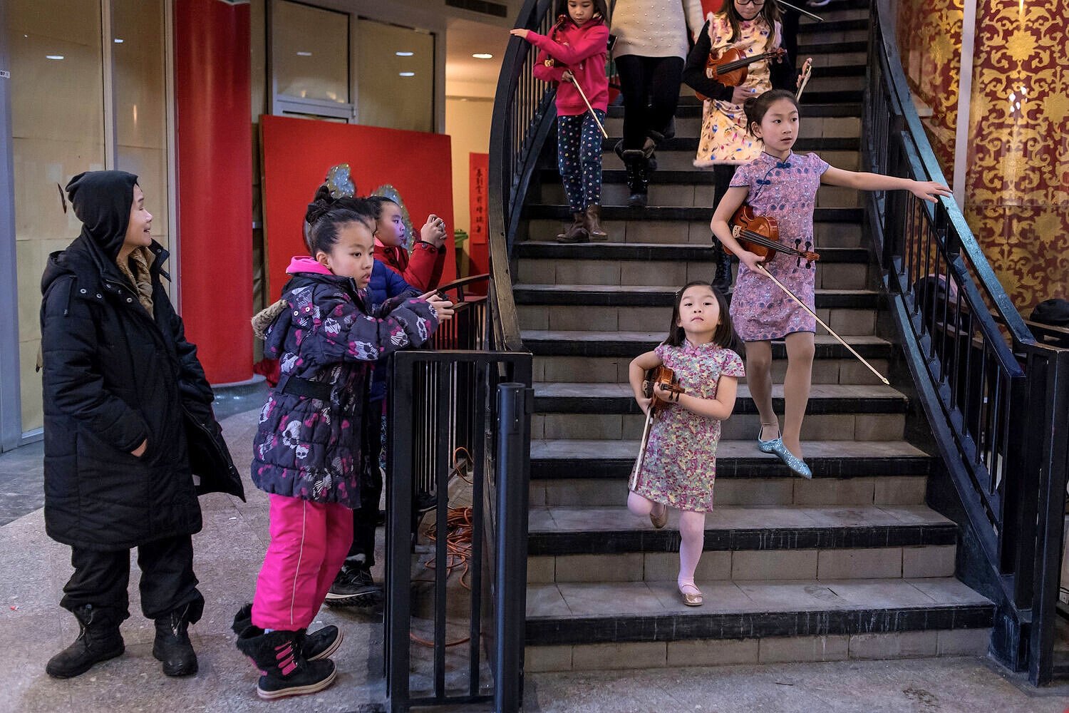  Young violin players gather to perform at the Calgary Chinese Cultural Centre. With a substantial number of middle-class families coming to Canada from Mainland China, parents can afford and push for early musical training. 
