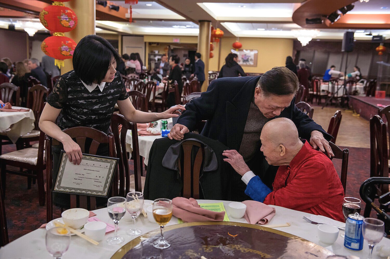 Kuo Him Yee (right) immigrated to Calgary in the 1960s from Hong Kong with his wife and five boys. Now in his 90s, he lives with one of his sons in Chinatown and has remained a member of the Yee Fung Toy Society since 1964.