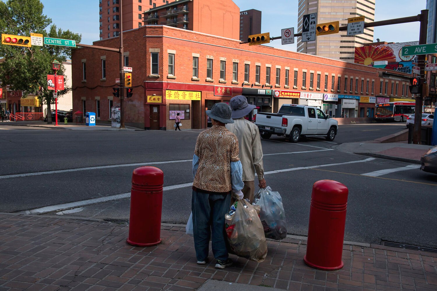Late afternoon light outlines the two-storey red brick Canton building. Constructed in 1910 by Chinese merchants, it remains a cornerstone of Calgary’s Chinese architectural heritage and is still home to some of Chinatown’s earliest family associati