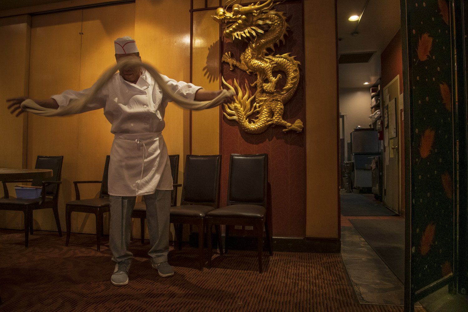  A chef makes noodles at one of Chinatown’s oldest and most known restaurant: The Silver Dragon. 