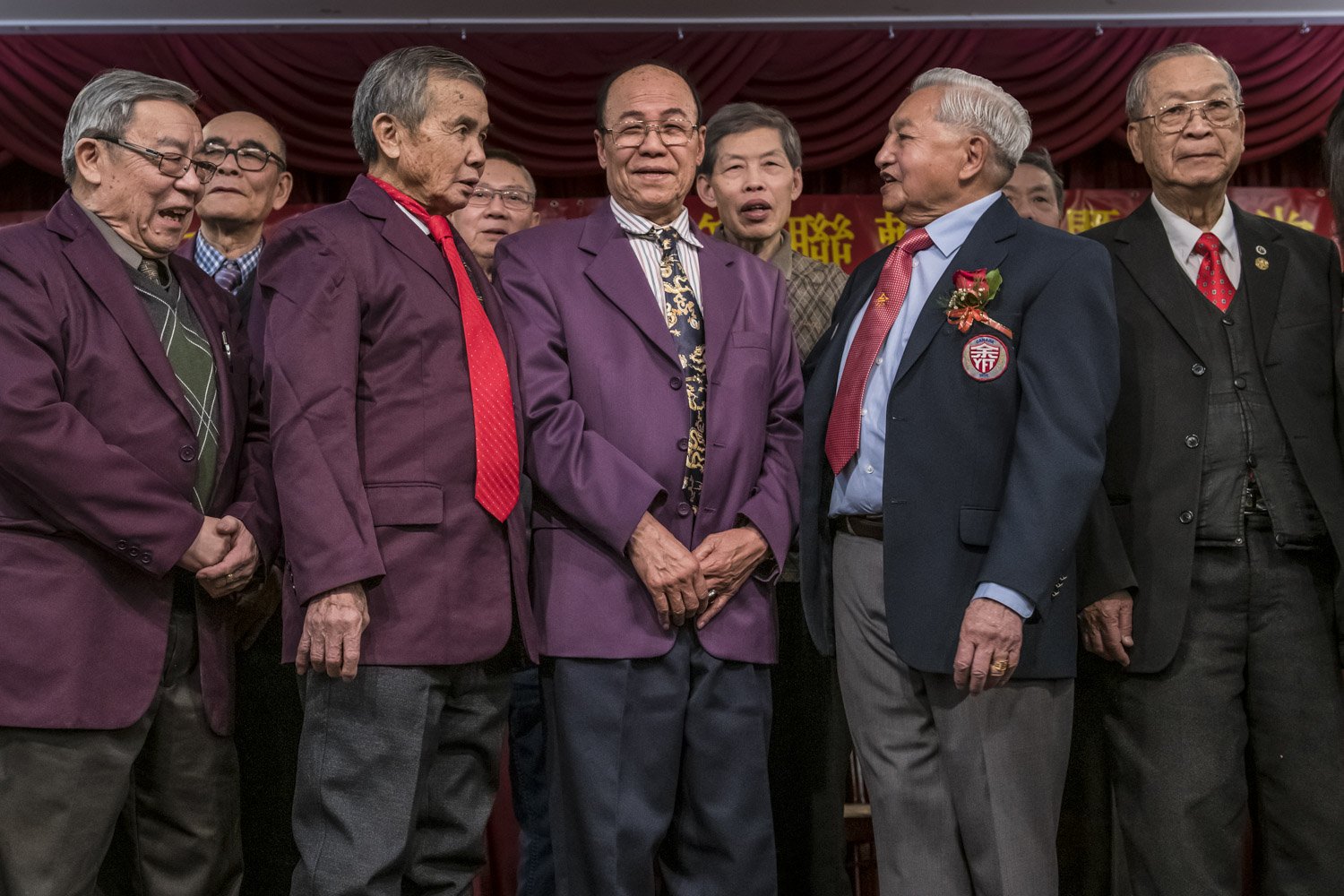 Members from the Yee Fung Toy Society poses for a portrait during a New Year celebration event. Several traditional clans composed of members with the same family name were established in Chinatown during the first quarter of the 20th century; like