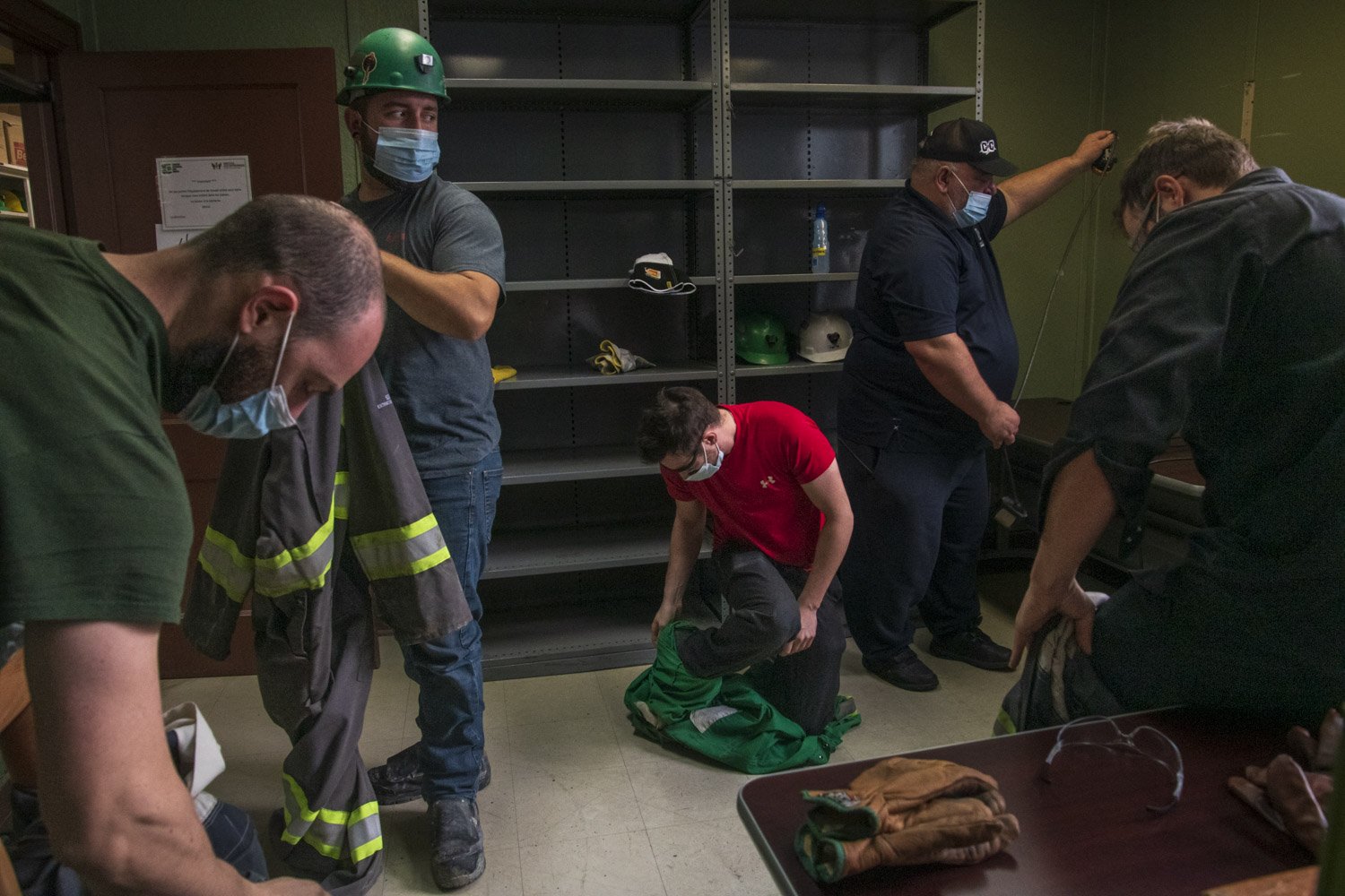 A group of students take their cover all off after an underground class at La Cité de l’Or. Students enrolled in a variety of trades have to follow rigorous underground training to successfully finds work in the mining industry. The experience learn