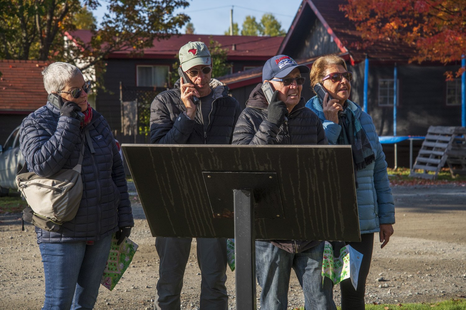  A group of tourists listen to audio devices during a walking tour of the mining village. Now a neighbourhood in the city of Val-d’Or, the village was declared a provincial heritage site in 1979 under Quebec’s Cultural Property Act now the Cultural H