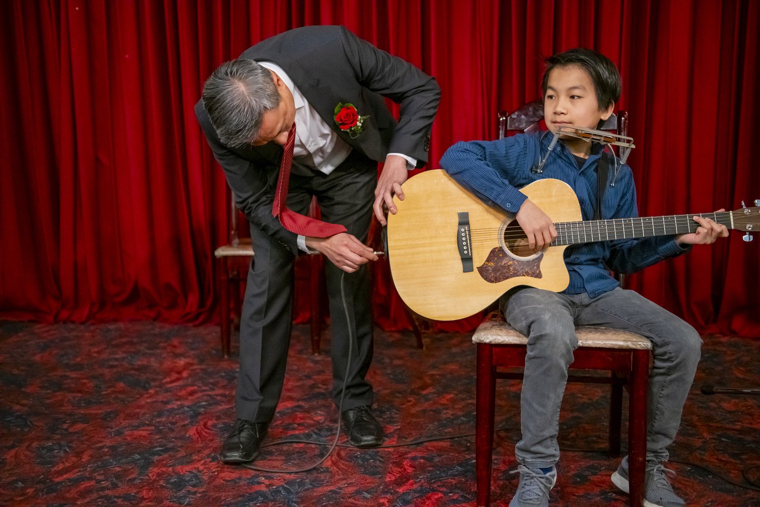  James Yee checks his son’s guitar before his performance of Bohemian Rhapsody by Queen during a family event. The young generation of Chinese Canadians are increasingly exposed and influenced by western culture. Therefore, more young Chinese study w