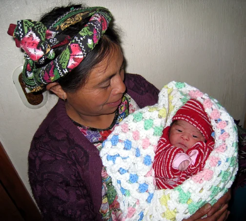 EduardoWithDonatedKnitBlanket_Jan2013.jpg