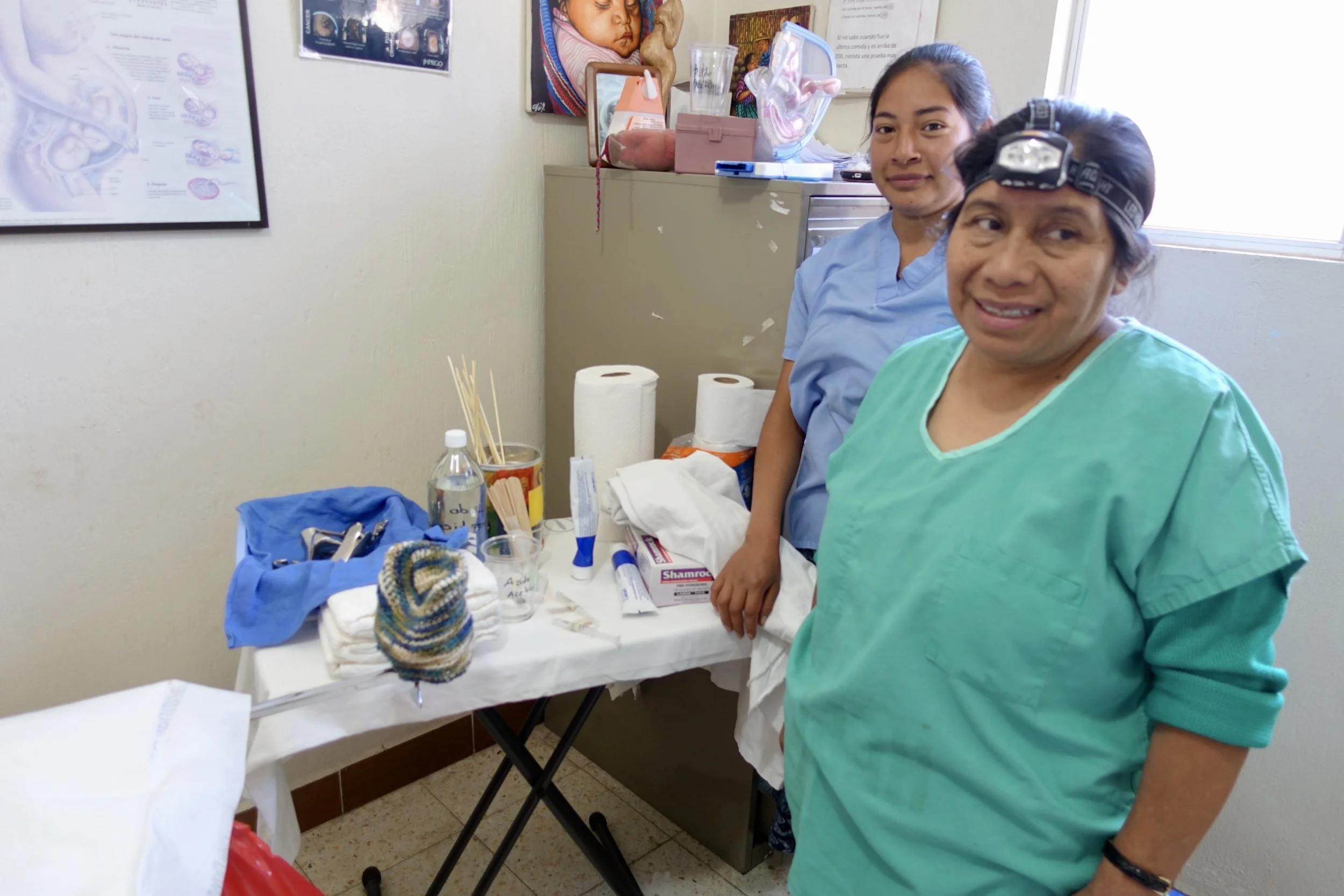 Midwives equip the consult rooms to prepare for the clinic