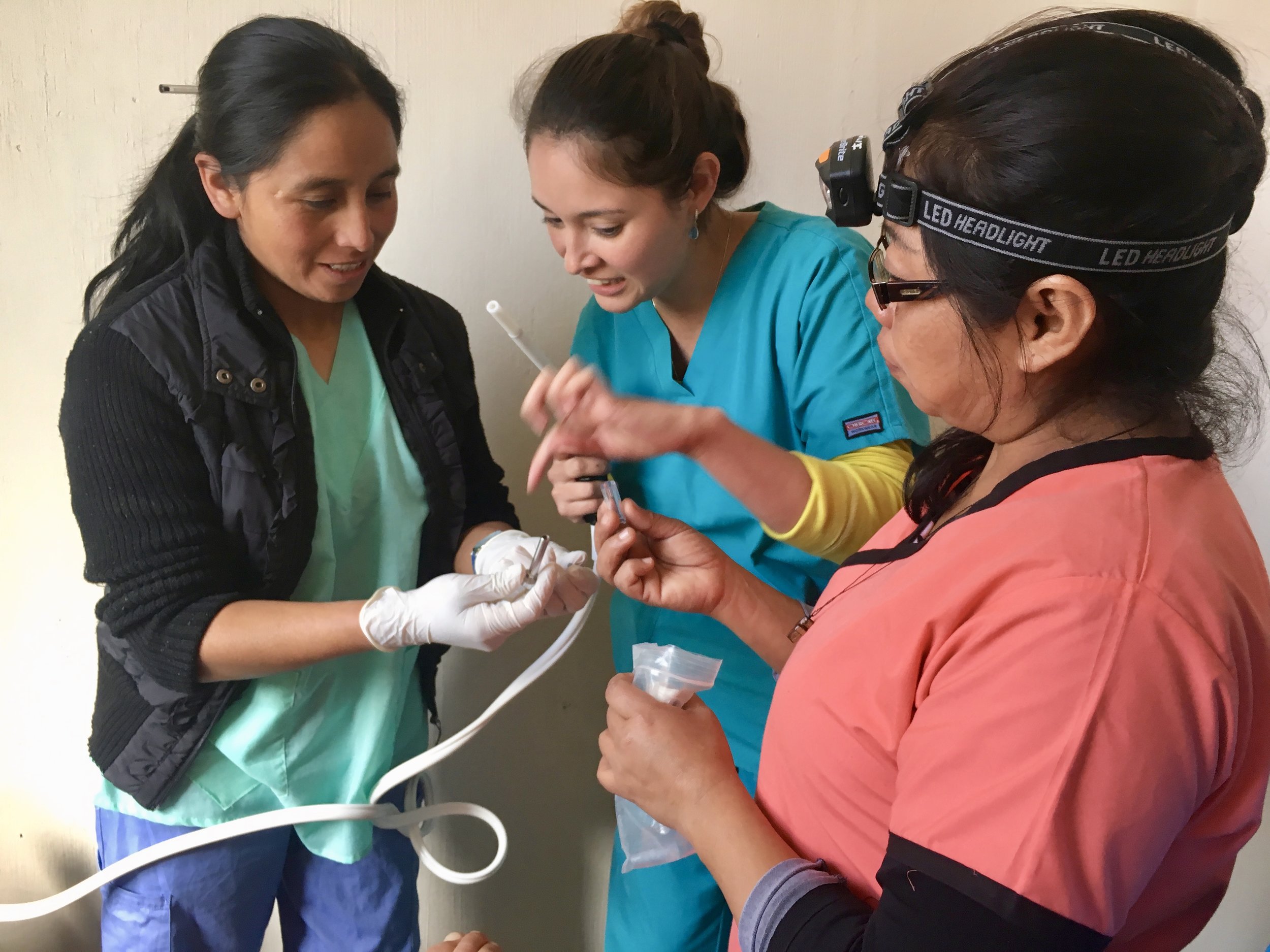 Imelda and Dr. Valeria prepare the cryotherapy equipment