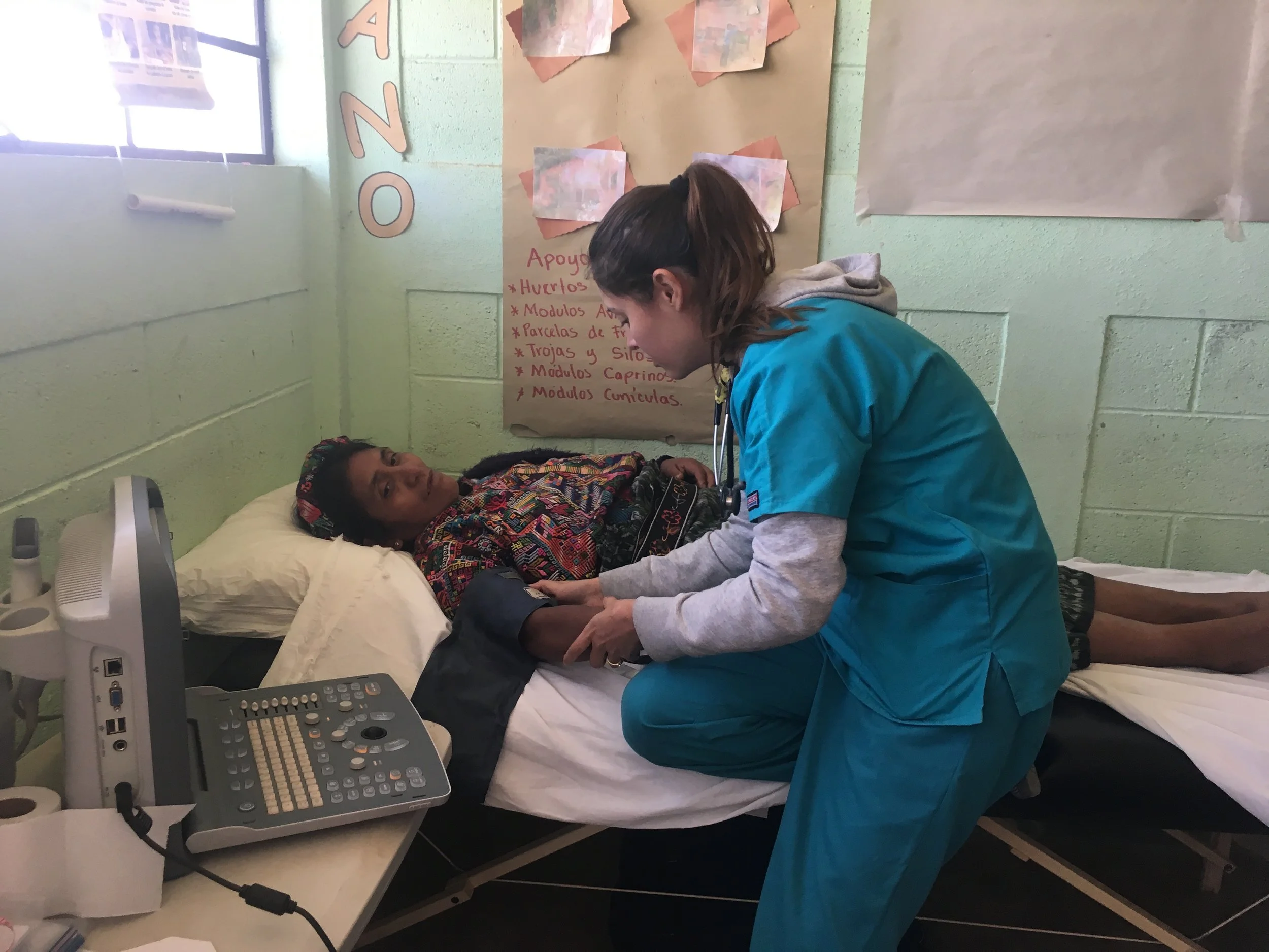 ACAM's Dr. Valeria examining a patient at a mobile clinic