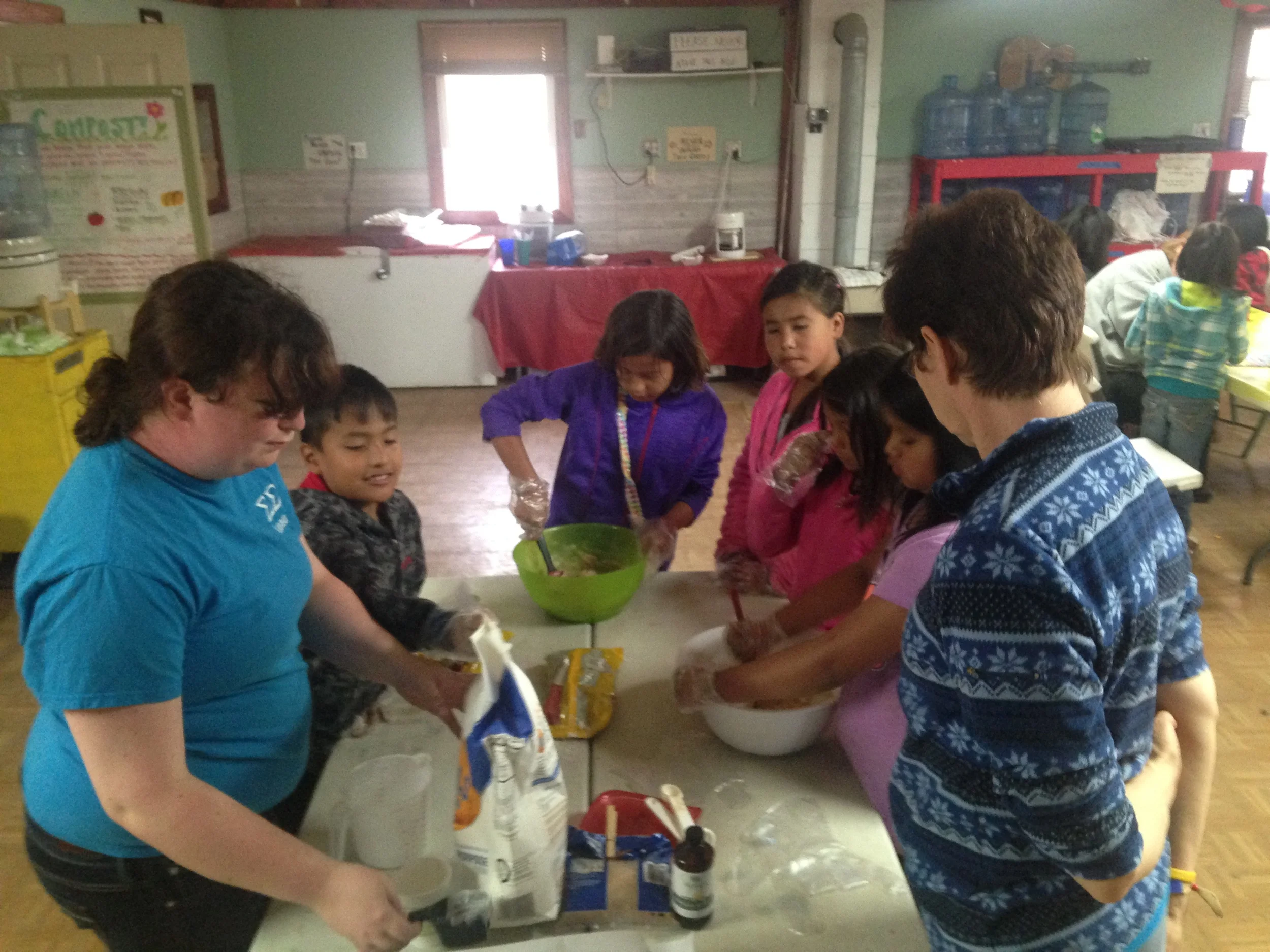 Fun with food: The kids make chocolate chip cookies with Rachel and Laura Westby for the town-wide meal on Friday!