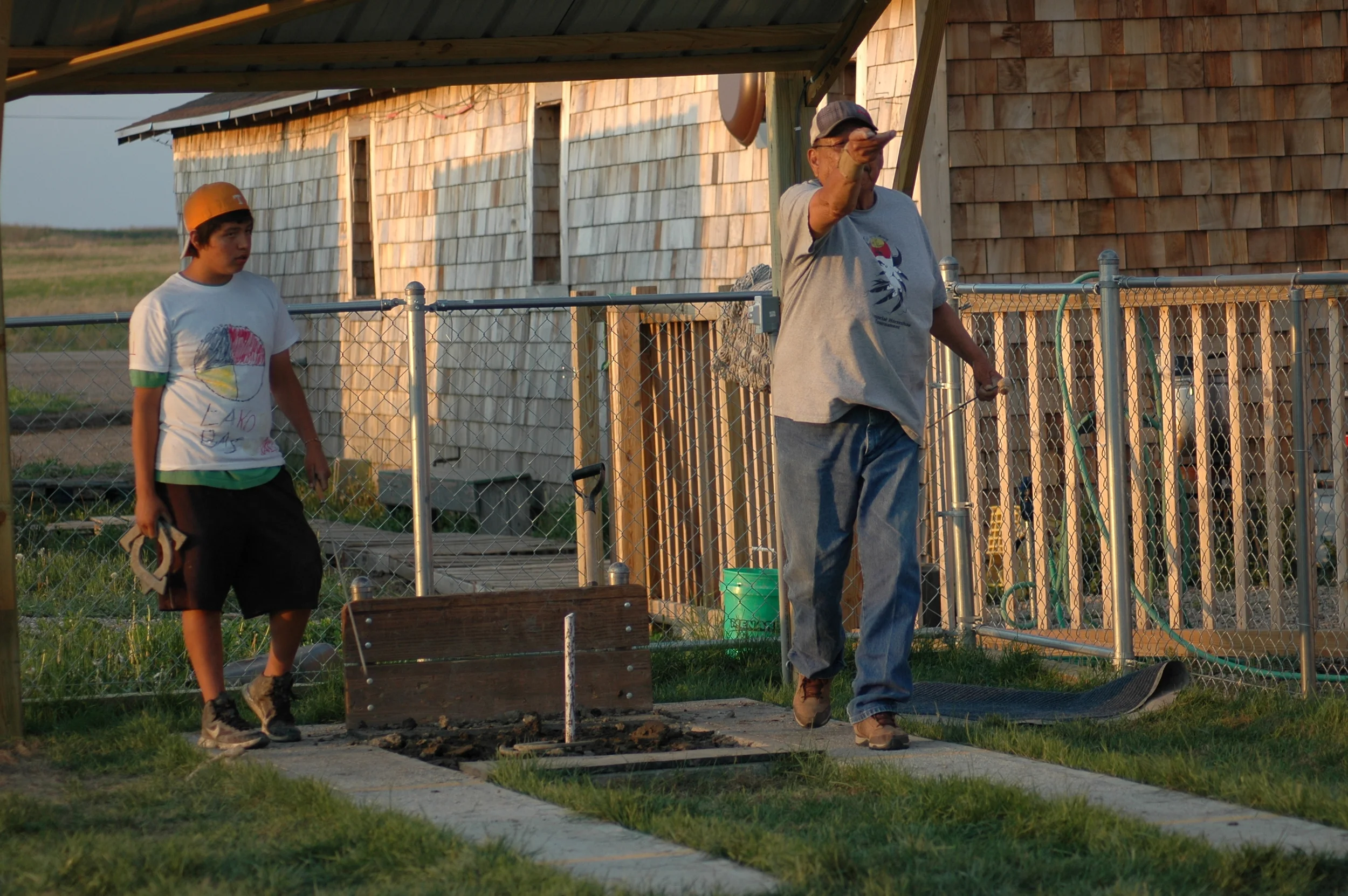 Ages young and elder appreciate and enjoy the horseshoe pit. It's a place to pass down both traditions and skills. (A.Gross, La Plant, May 2015)
