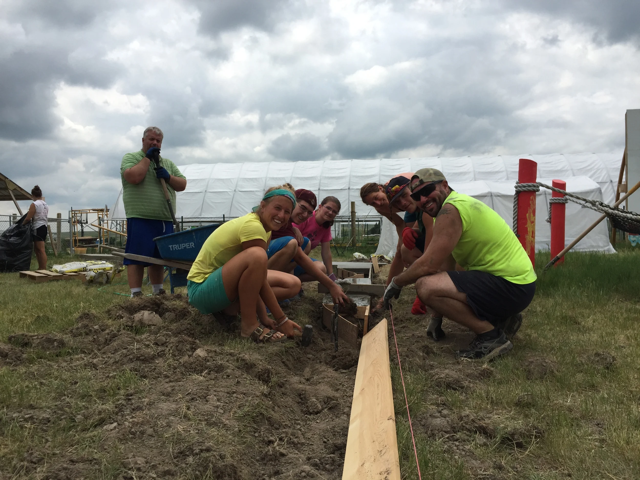 Planning for play: Our friends from Wapping work with Emma and Sam to prepare the ground and border for an upcoming playground project!
