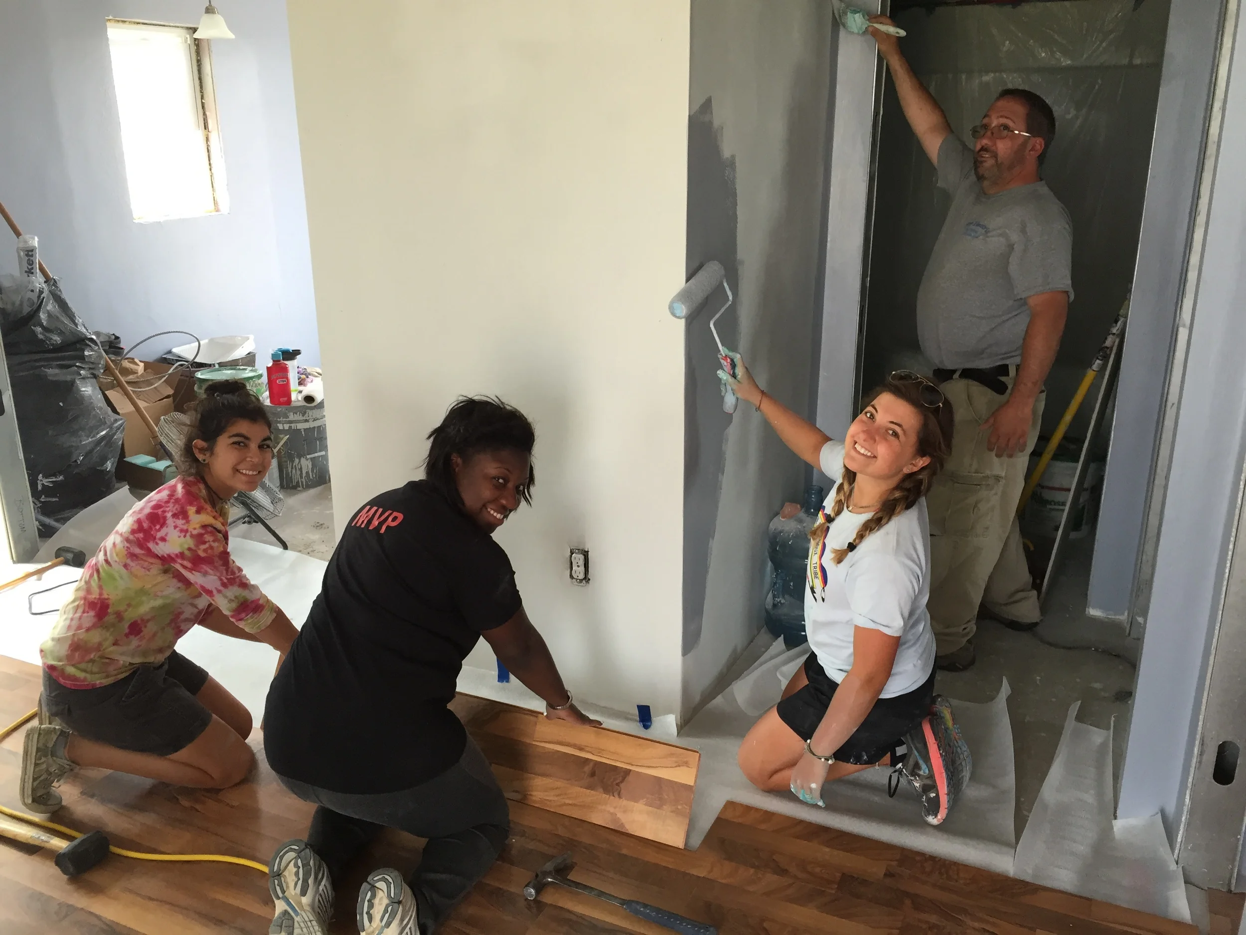 Smiles abound among our interns and volunteers at the new house project, including Nakia Letang, associate director of admissions at Fairfield University, and Dom Mastroni, from Milford, CT! (Z. Gross, August 2015, La Plant")
