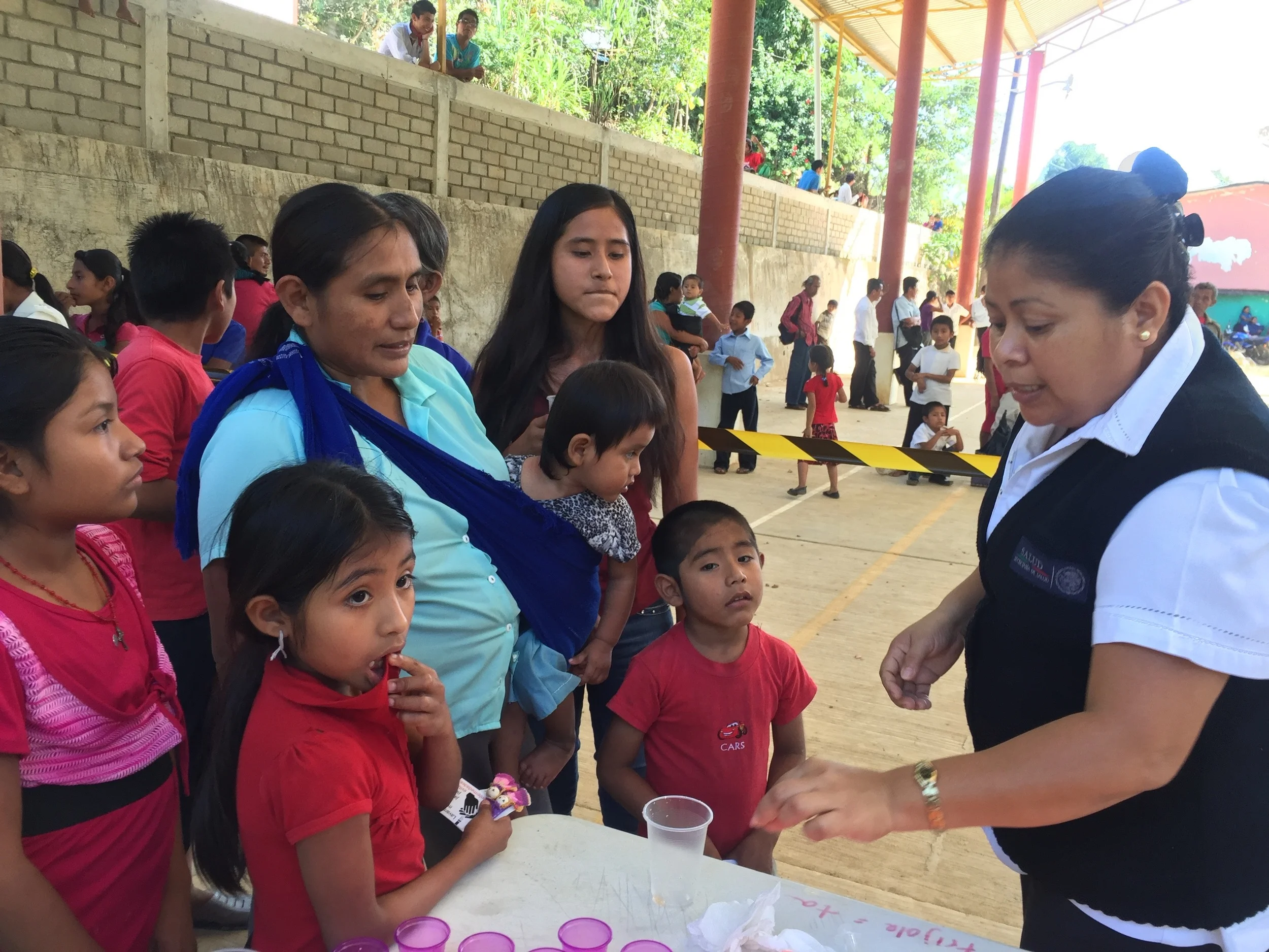 Nurse Bernarda Lopez Ordaz helps us to distribute treatment to children in Santa Maria Tepexipana (November 2015)