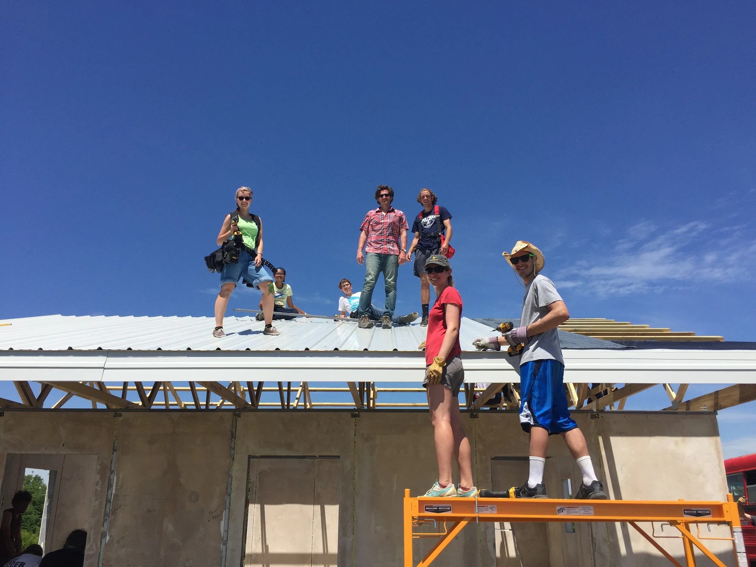 Taking great heights to build strong, safe, secure homes: Thanks to our amazing volunteers and interns who worked alongside Bryan to put the roof on Ford's new home!