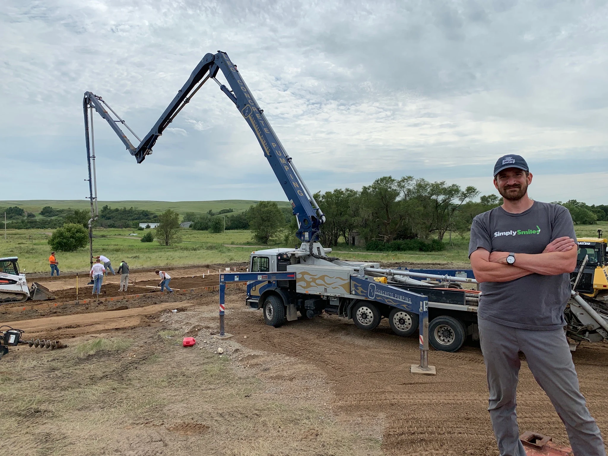 7/24/19: Simply Smiles President and Founder Bryan Nurnberger at the site of our Children’s Village as the concrete slab is being poured.