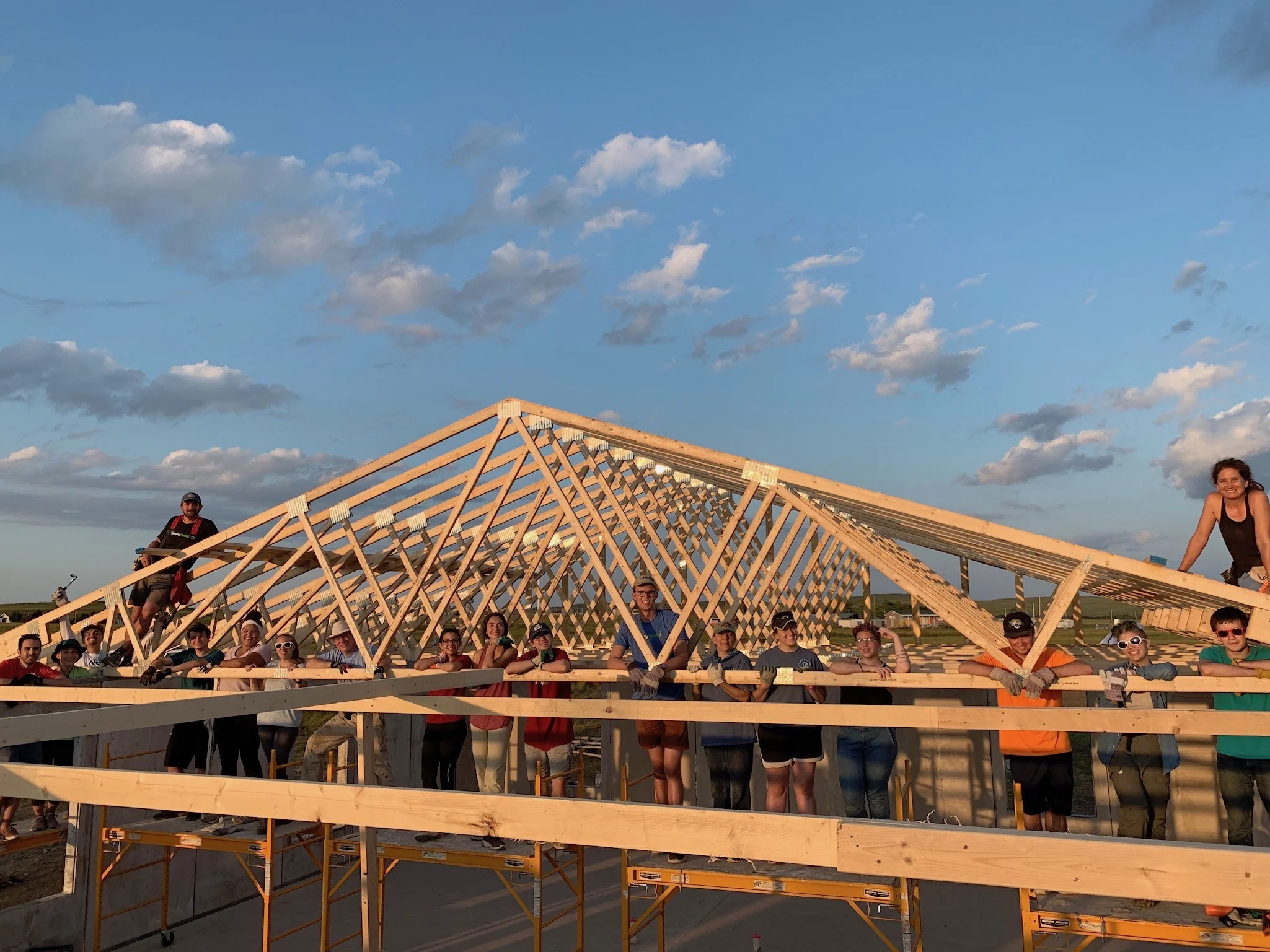 8/5/19: The first of the roof trusses are installed by amazing Simply Smiles volunteers and staff!