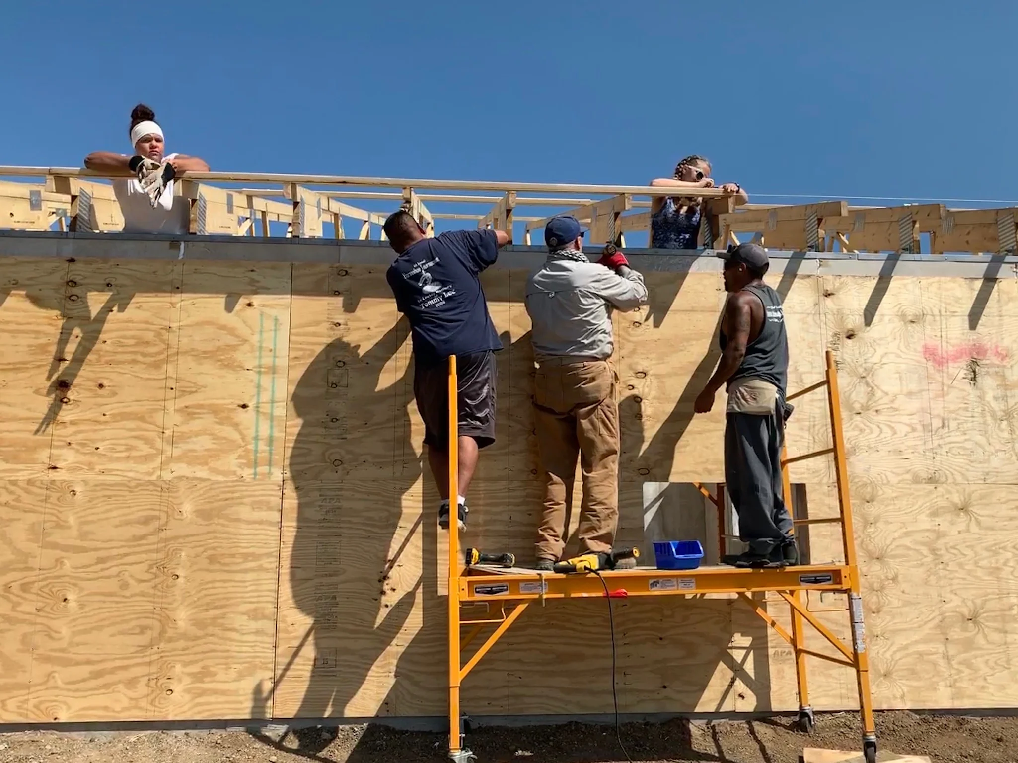 8/8/19: With the exterior walls up, the sheathing installation begins.