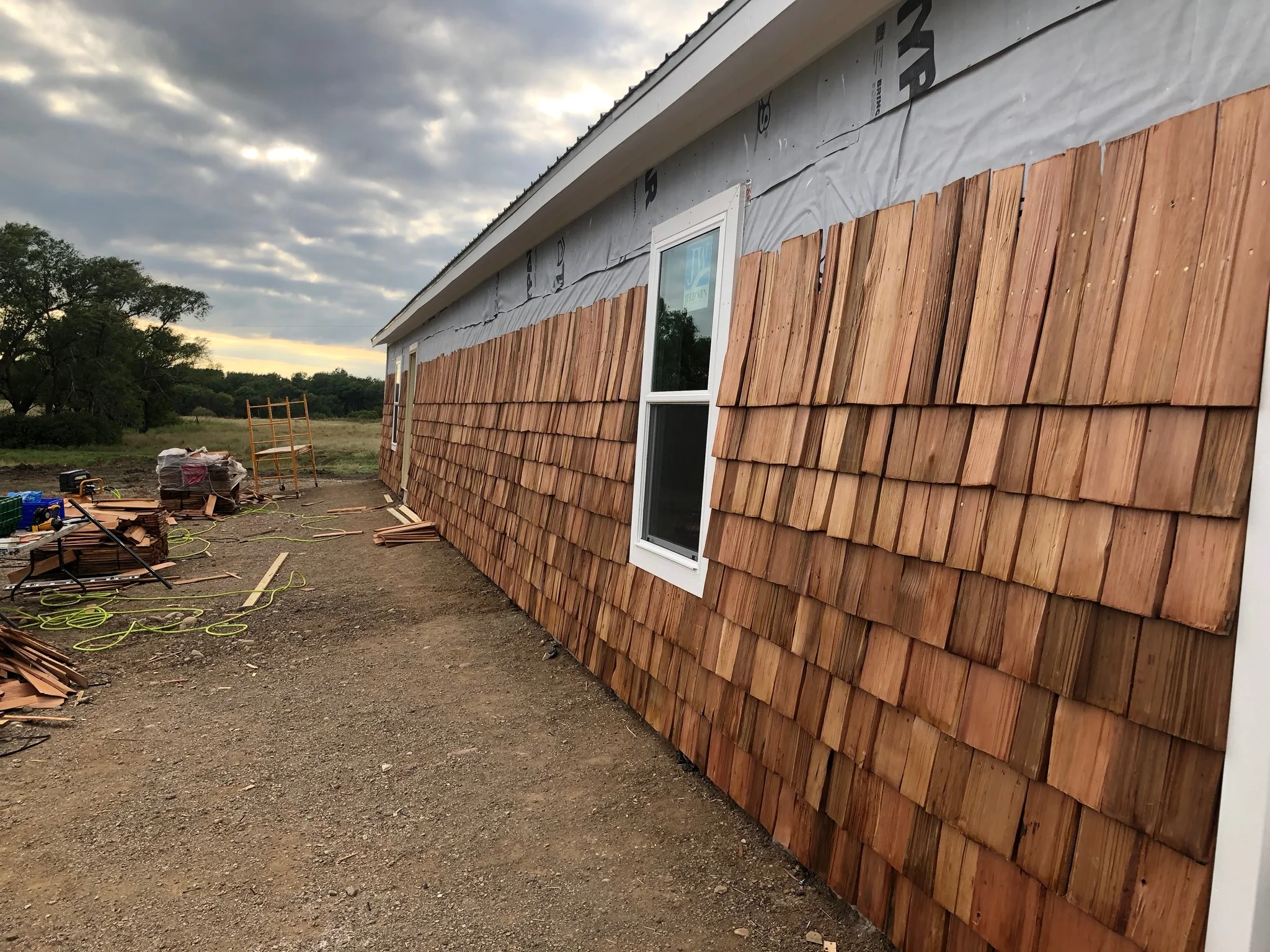 The exterior of the first building gets cedar shingles!