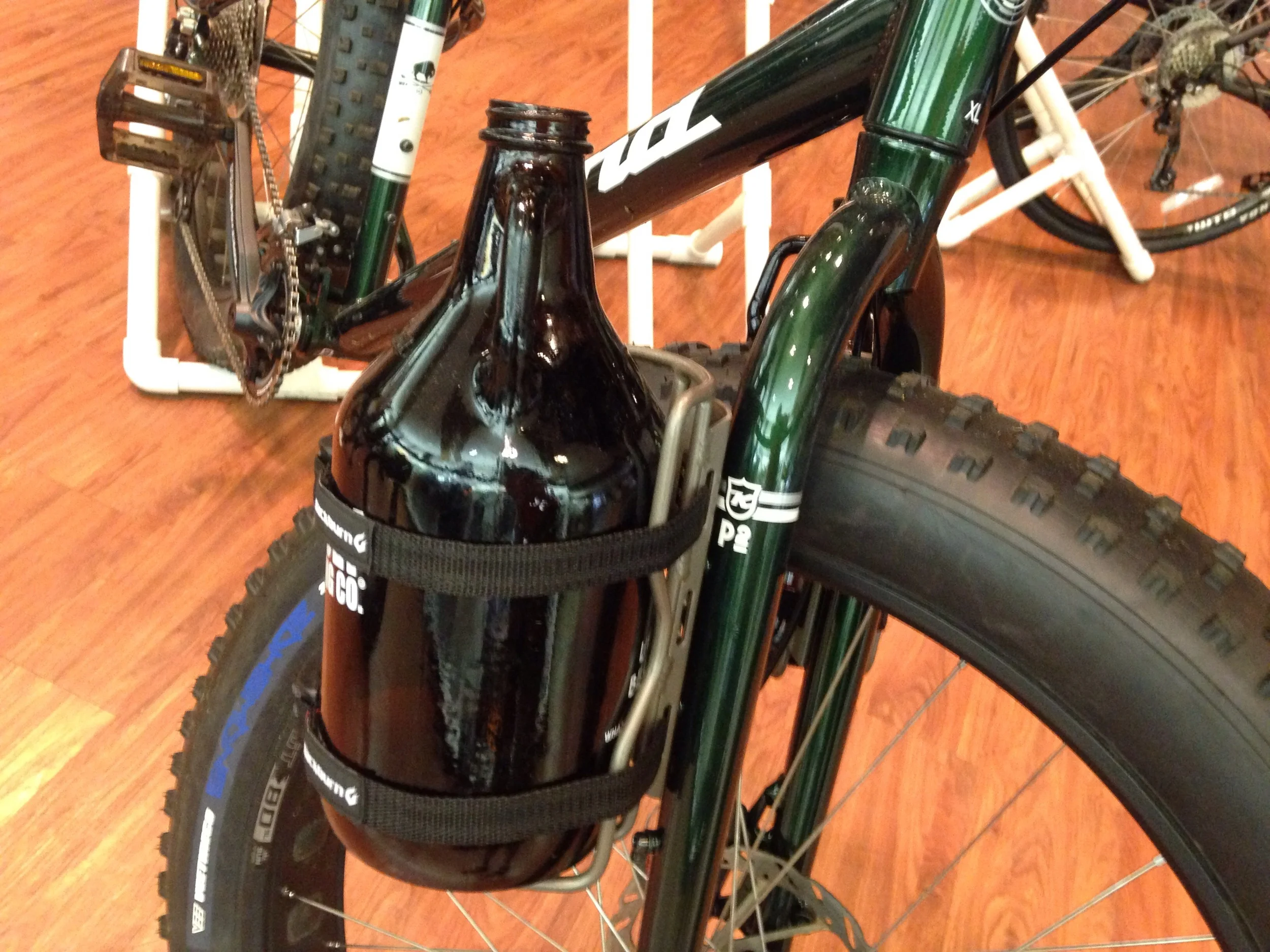 Cargo Cages from Blackburn. Used with a growler here, but can also be used a drybag or a place to carry a tent. 
